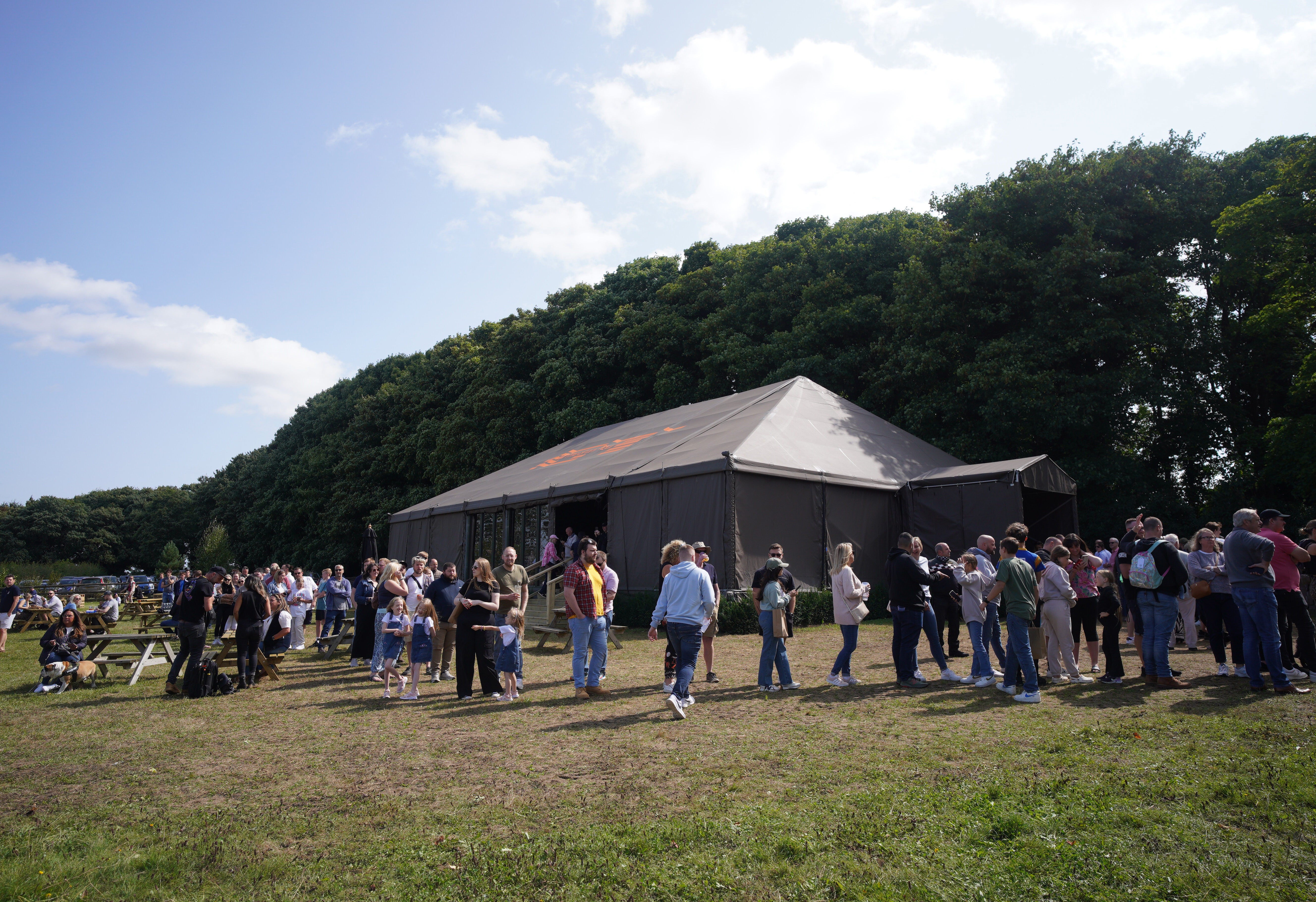 People queuing outside at the opening of Jeremy Clarkson’s new pub, The Farmer’s Dog, in Asthall, near Burford in Oxfordshire in August. His farm could be subject to inheritance tax (Ben Birchall/PA)