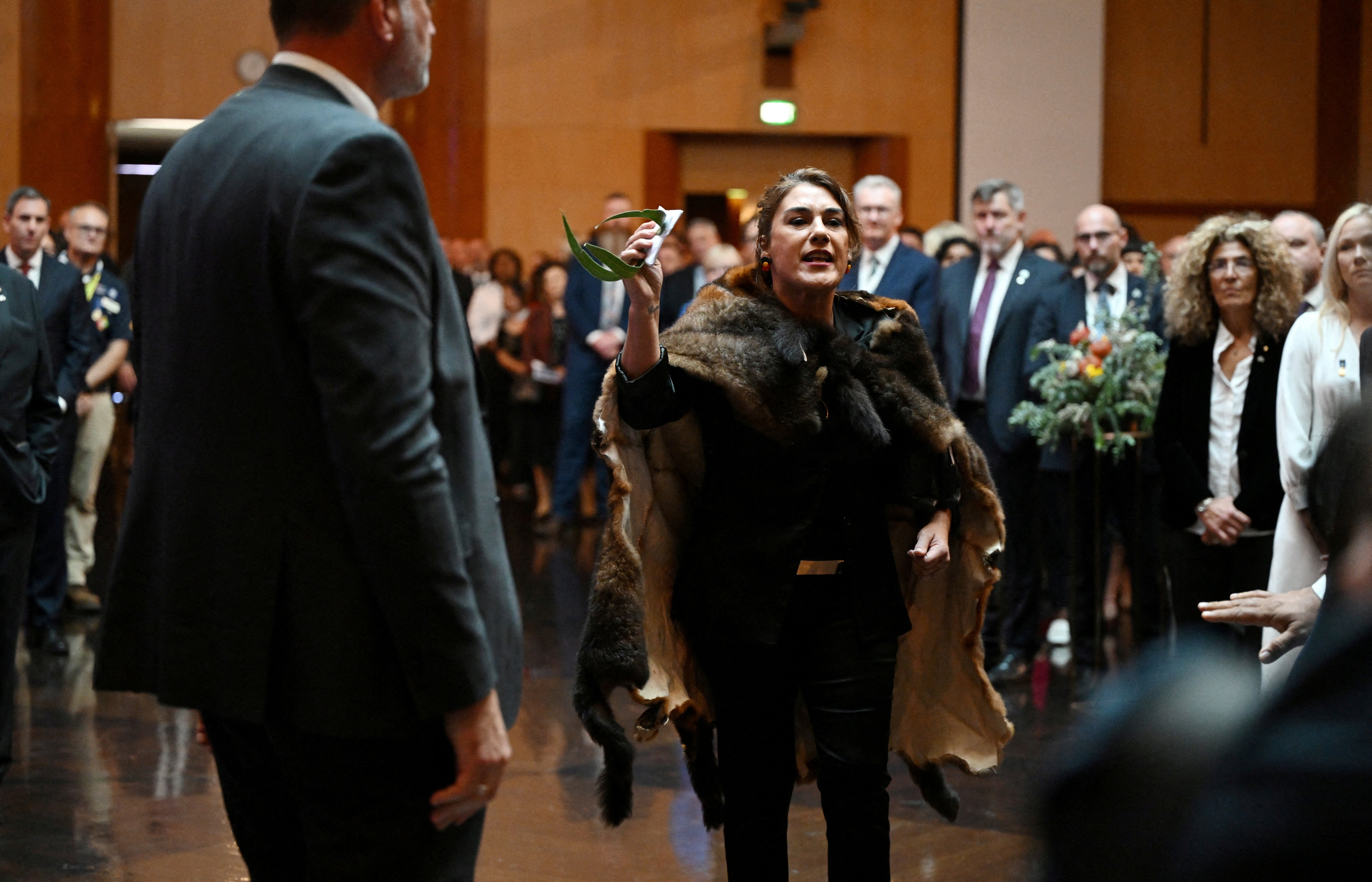 Australian senator Lidia Thorpe stages a protest as Britain's King Charles and Queen Camilla attend a Parliamentary reception in Canberra, Australia