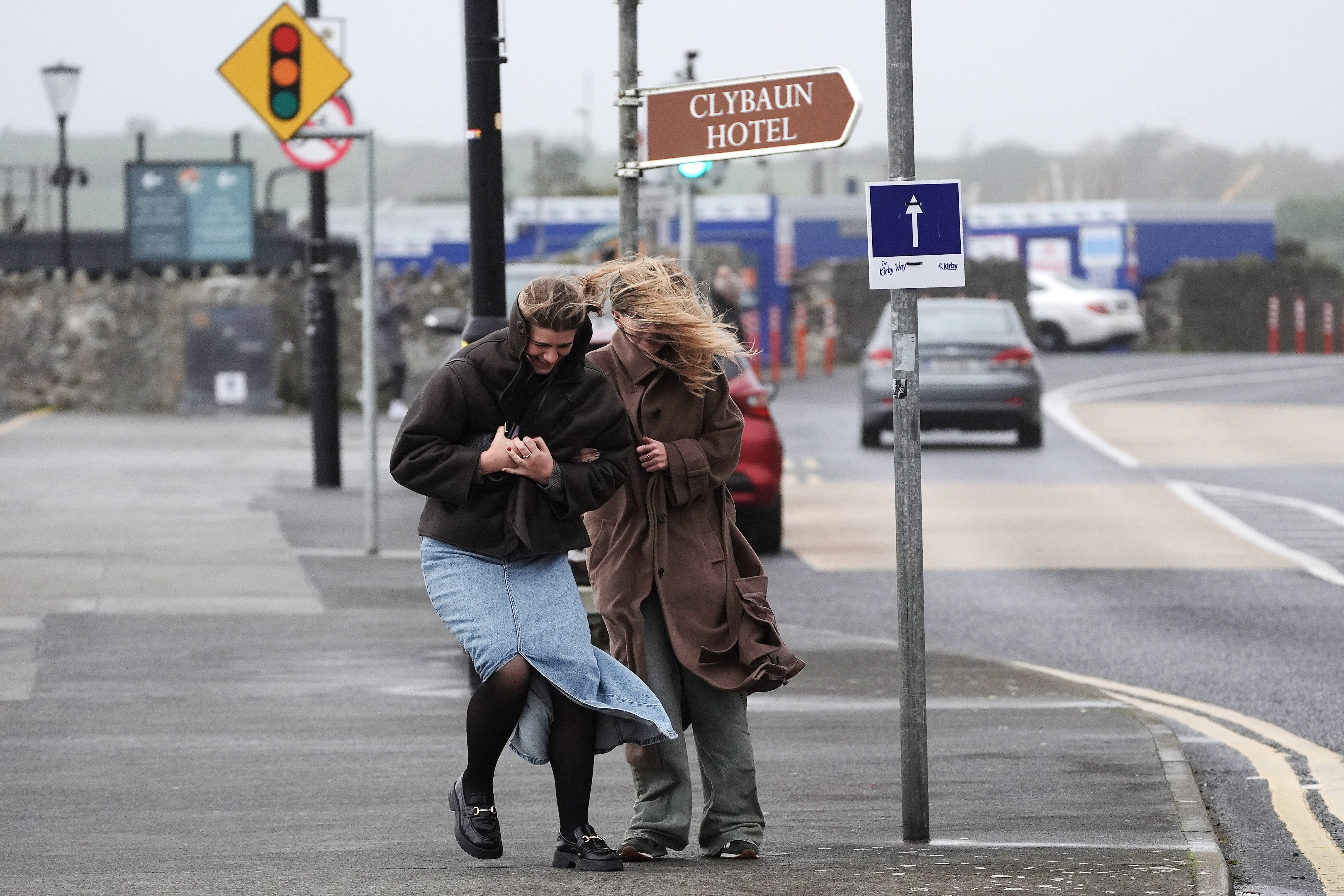 People struggle to walk in the wind on the promenade in Salthill, Galway, as a Met Eireann orange alert for Kerry, Leitrim, Sligo, Clare, Donegal, Mayo and Galway came into effect at 10am on Sunday and will be in place to 8pm as Storm Ashley sweeps across the island of Ireland.