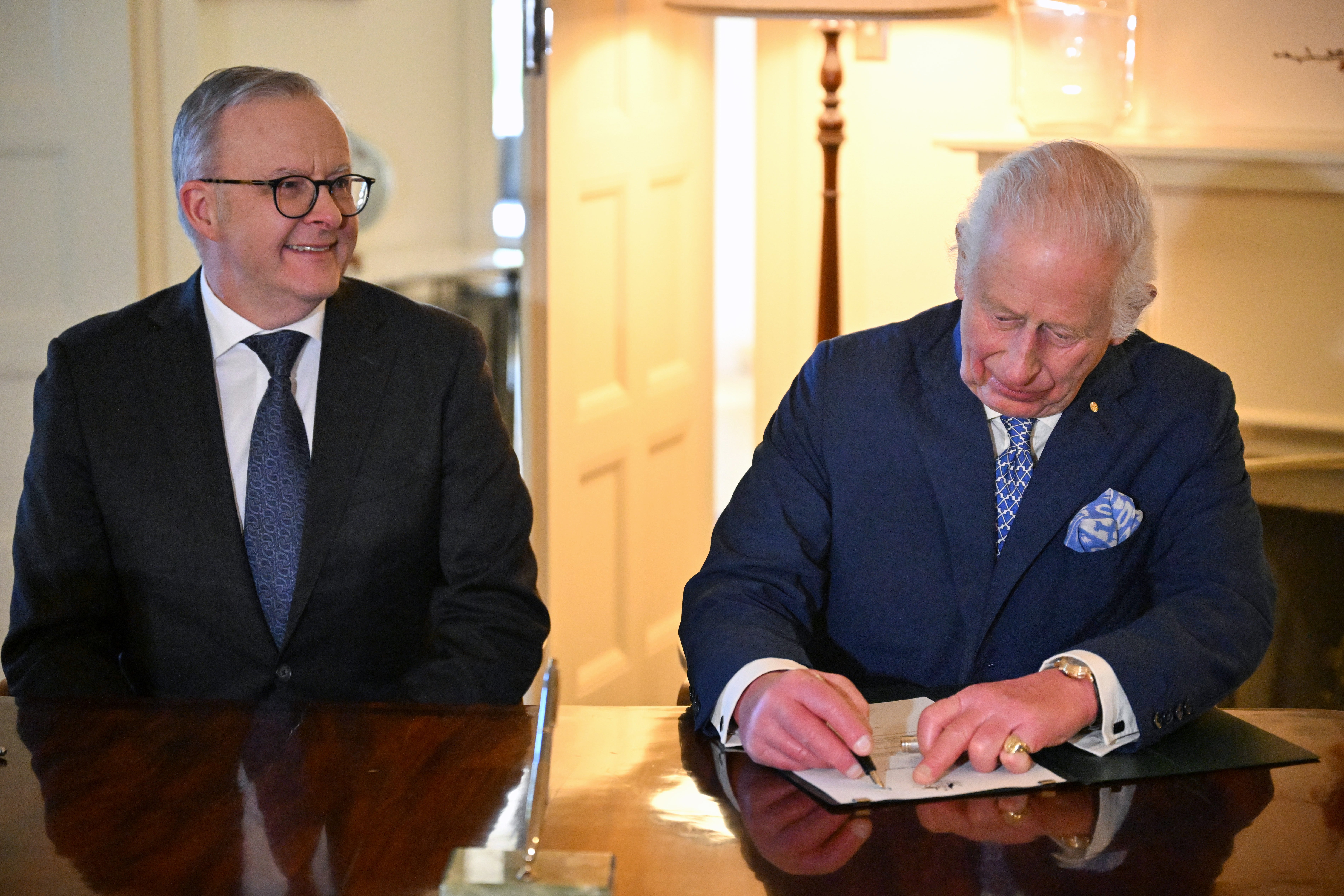 Australian Prime Minister Anthony Albanese and King Charles III sign a royal warrant granting the Great Seal of Australia at Australia's Government House