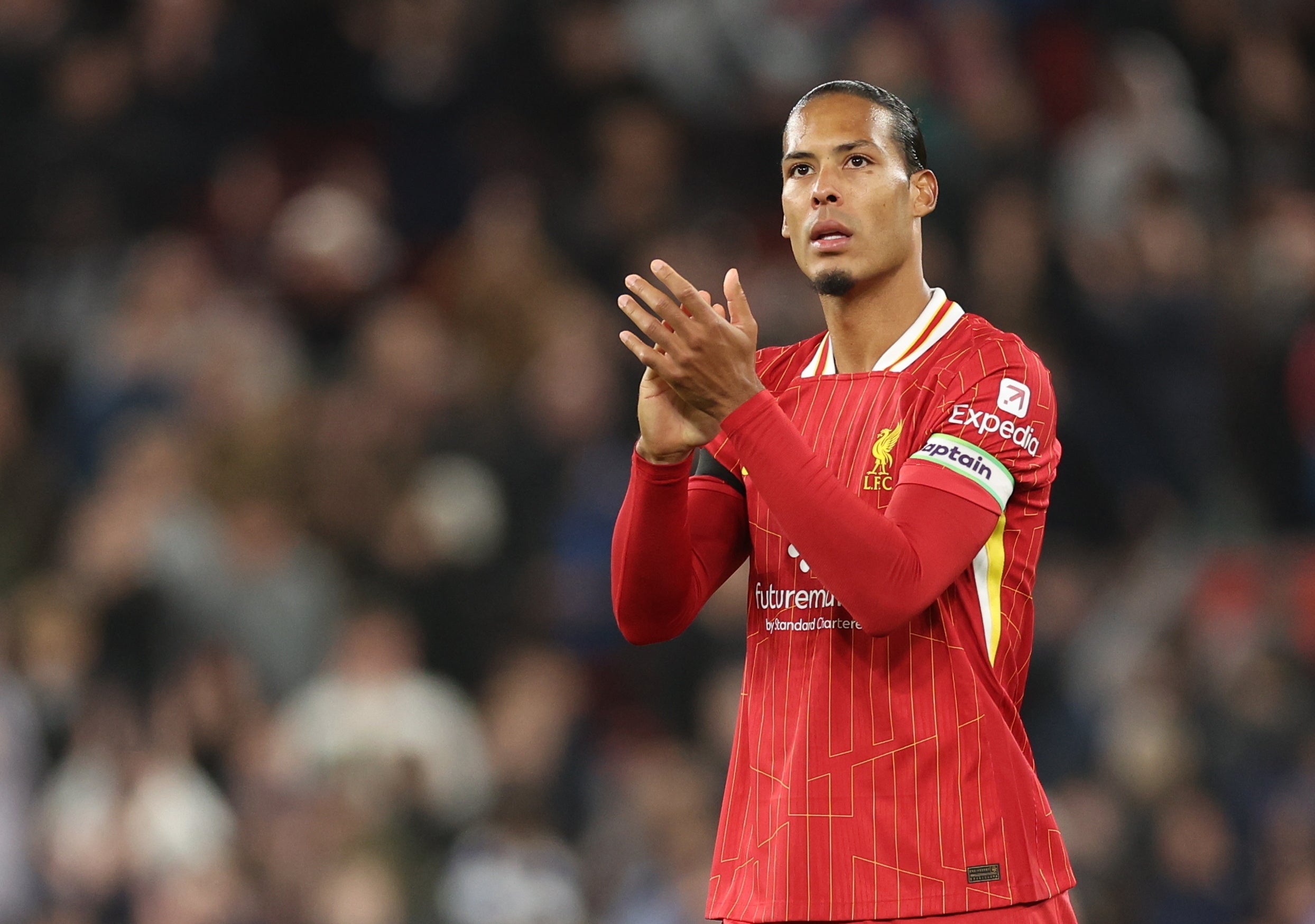 Liverpool captain Virgil van Dijk applauds fans at full-time