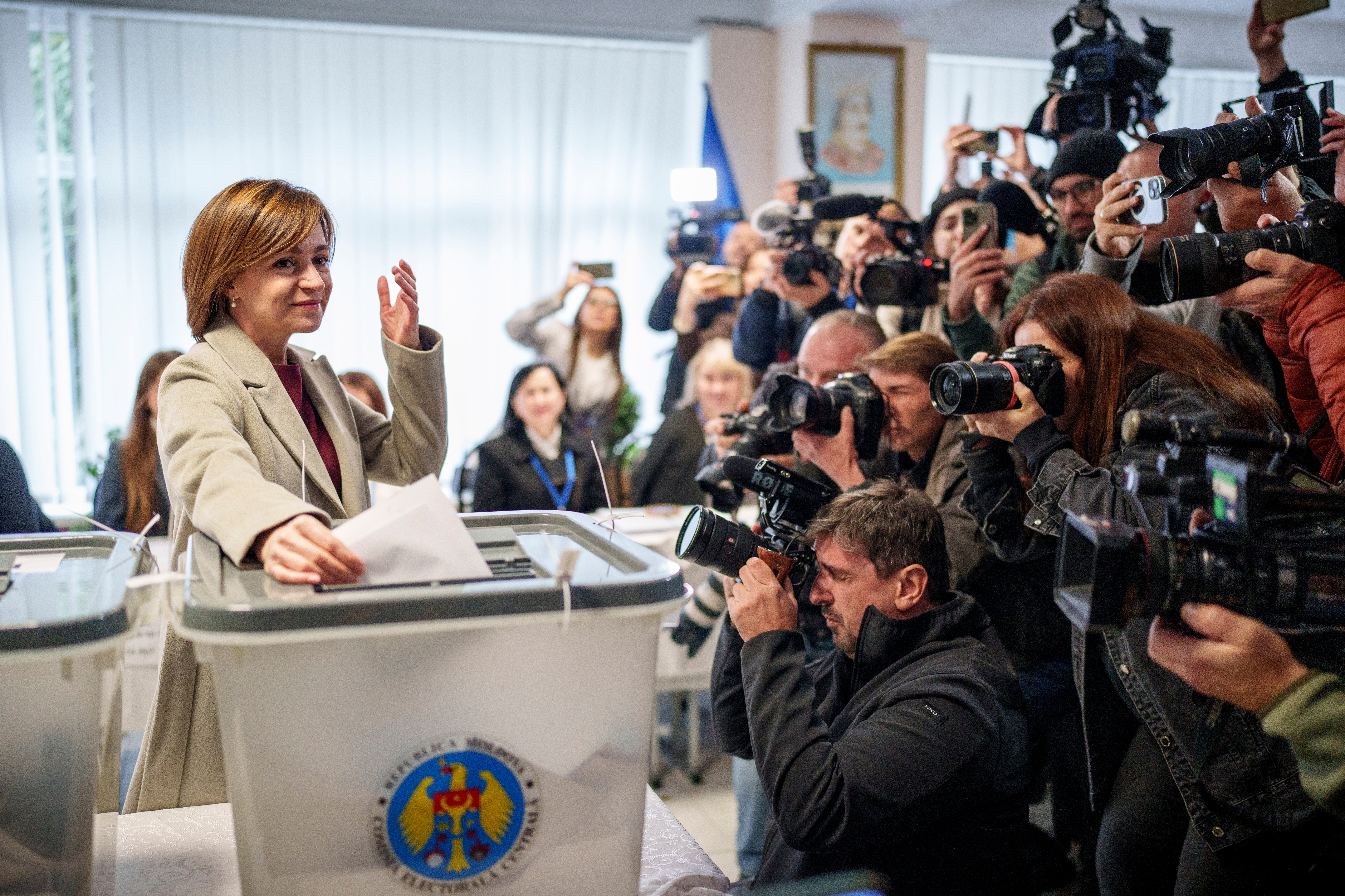 Moldova’s president Maia Sandu prepares to cast her vote in the capital Chisinau on Sunday