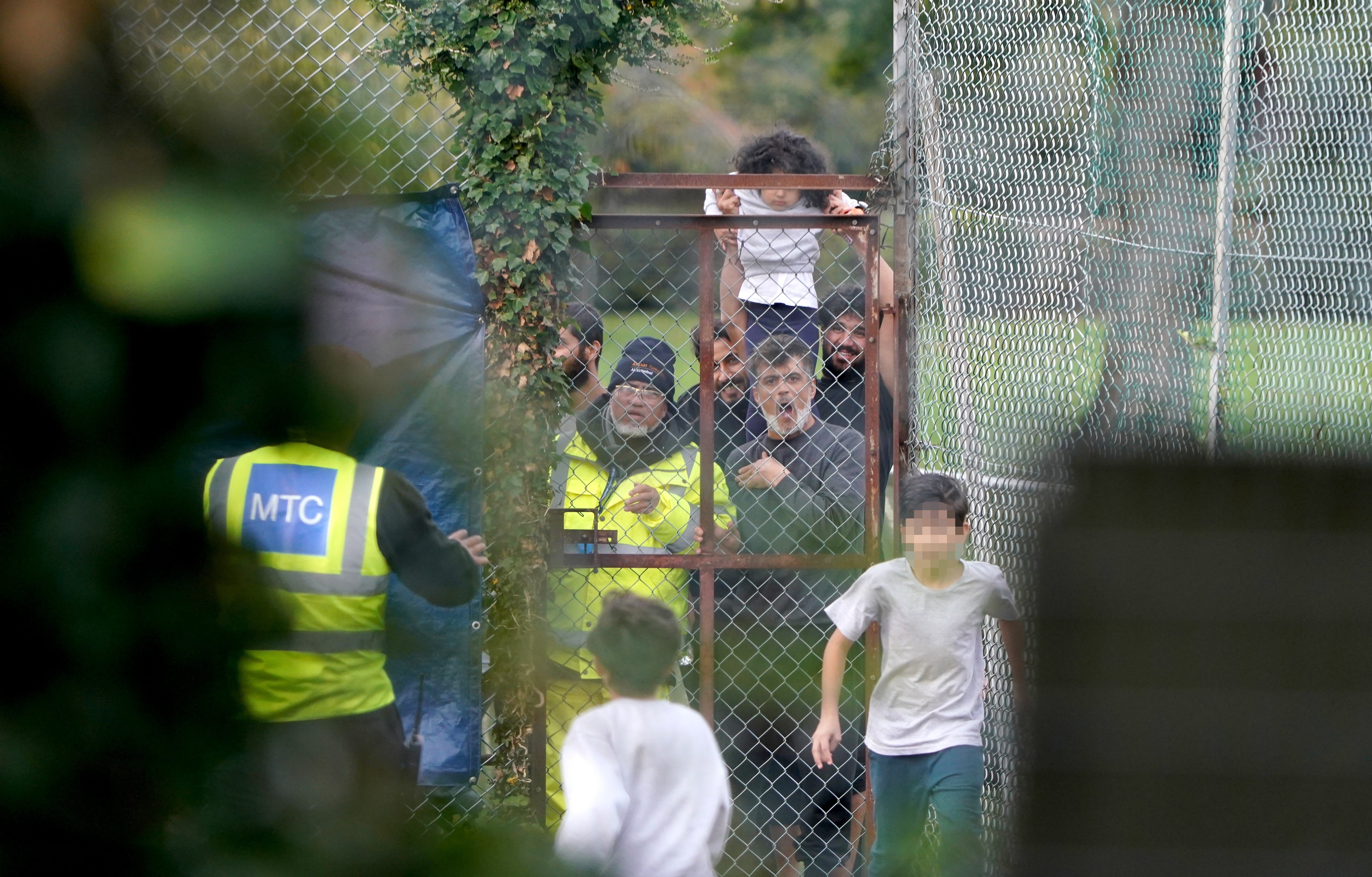 A view of migrants inside the Manston immigration short-term holding facility