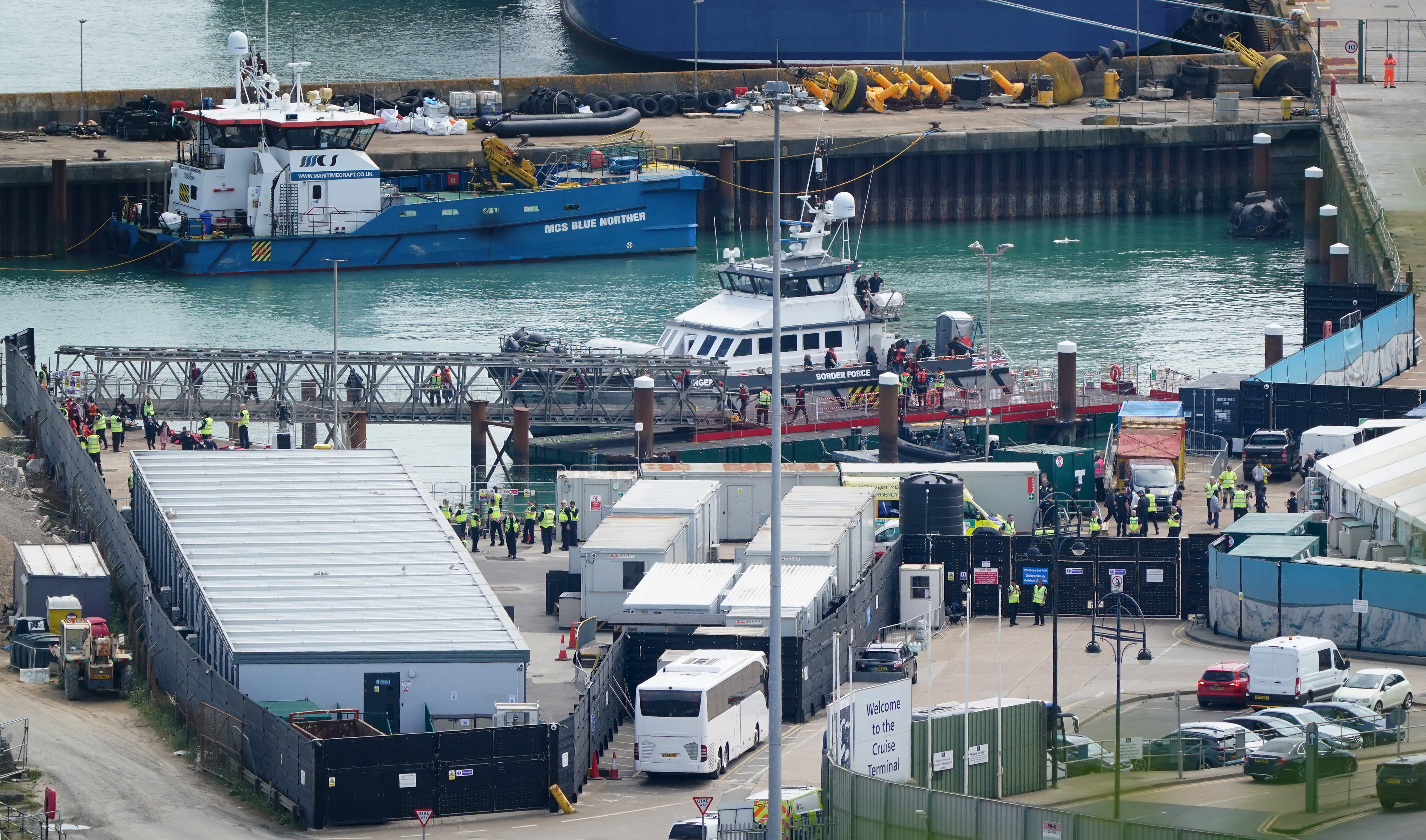 A view of the scene at Western Jet Foil in Dover, Kent, as group of people thought to be migrants are brought to shore from a Border Force vessel