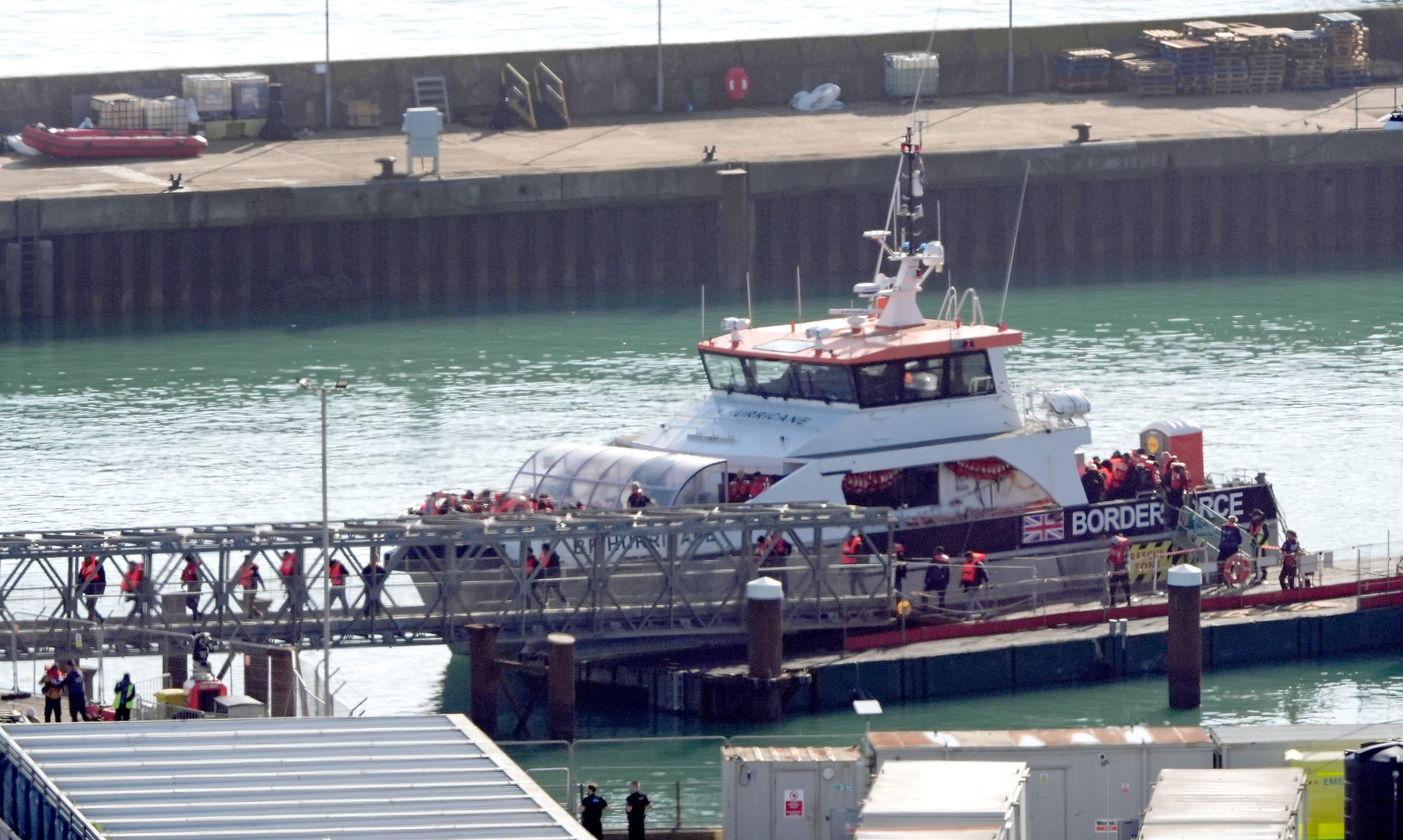 A group of people thought to be migrants are brought in to Dover, Kent, from a Border Force vessel in mid-October 2024