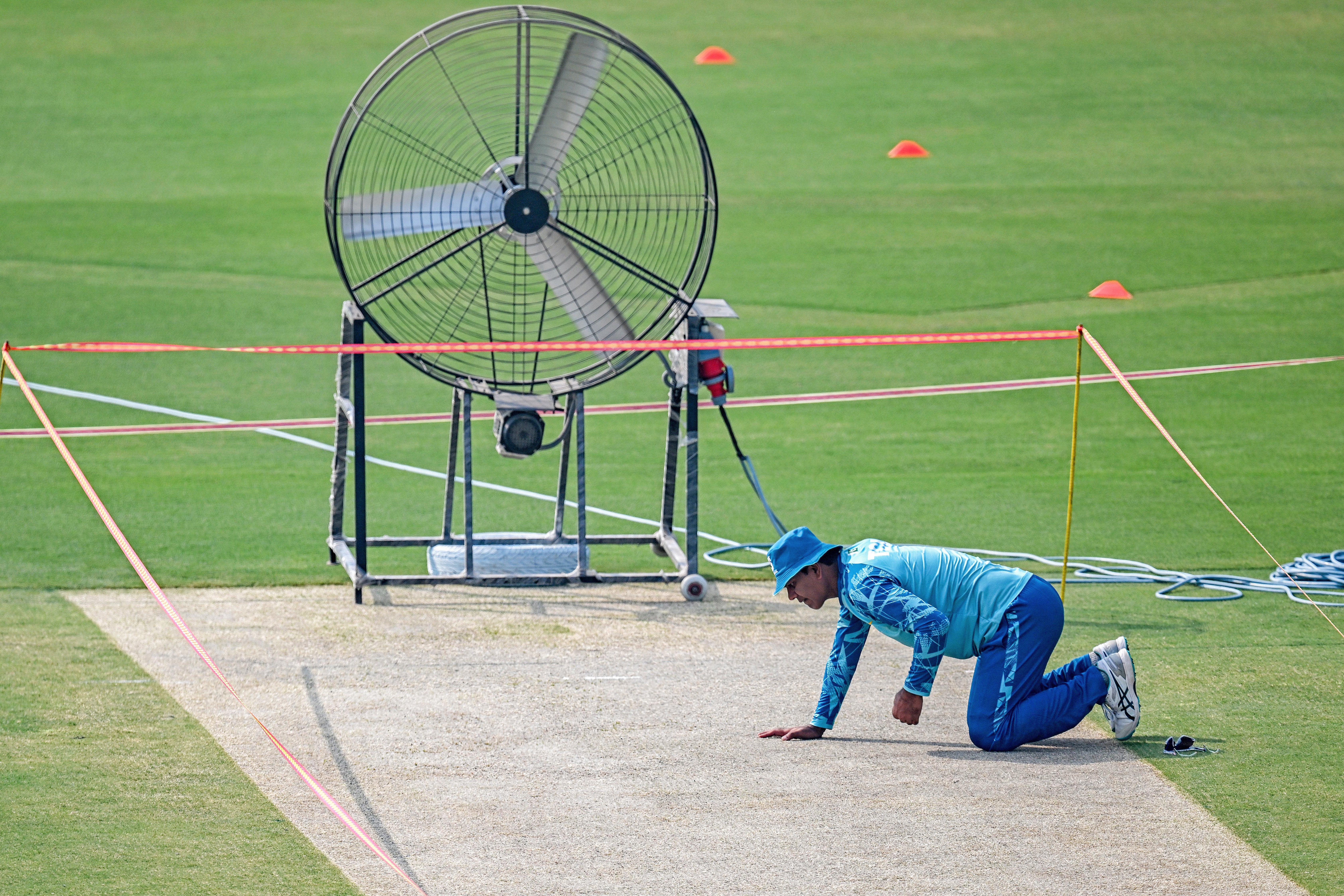 Pakistan’s Noman Ali inspects the pitch during a practice session on Monday