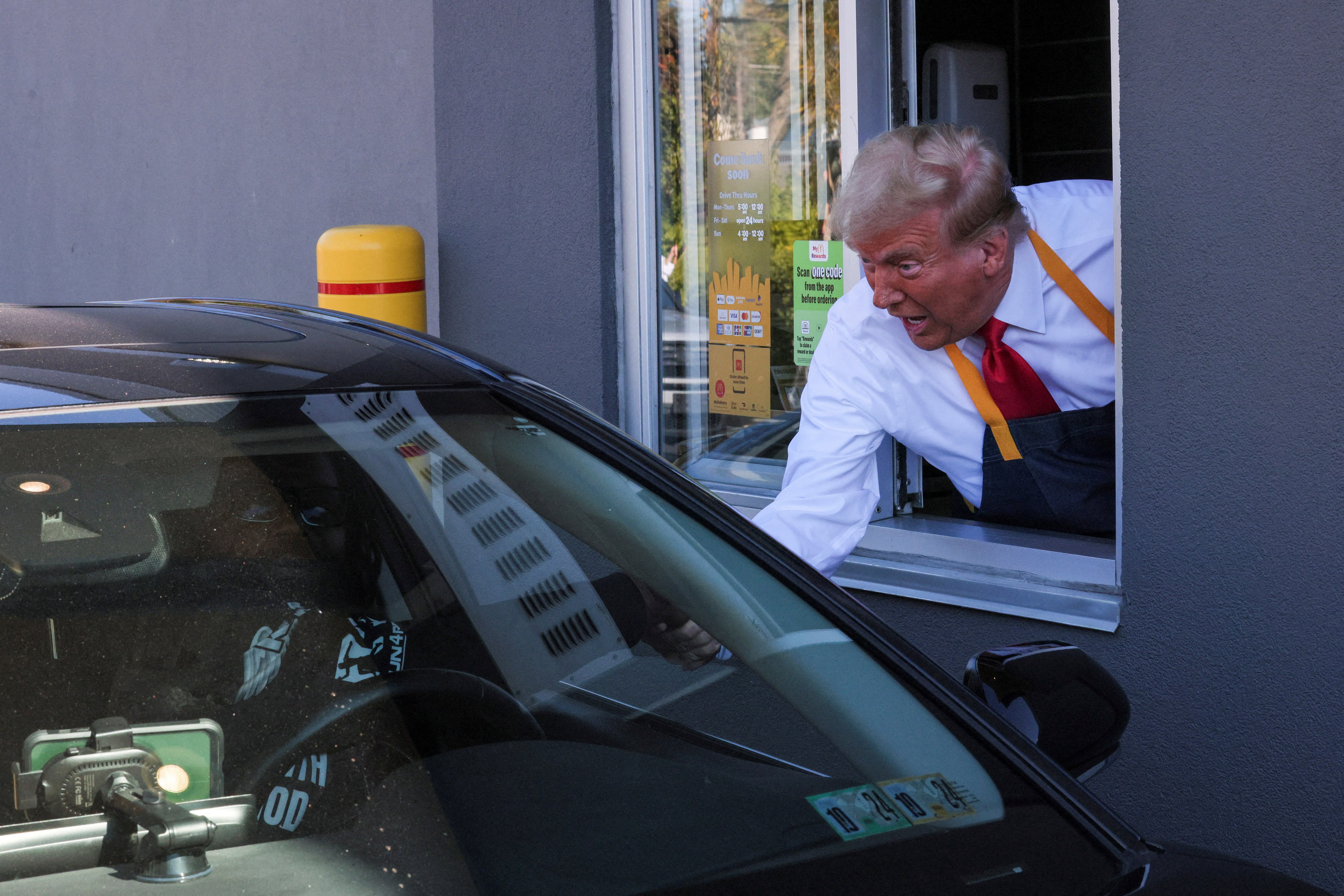 Trump handed at food at the drive through window