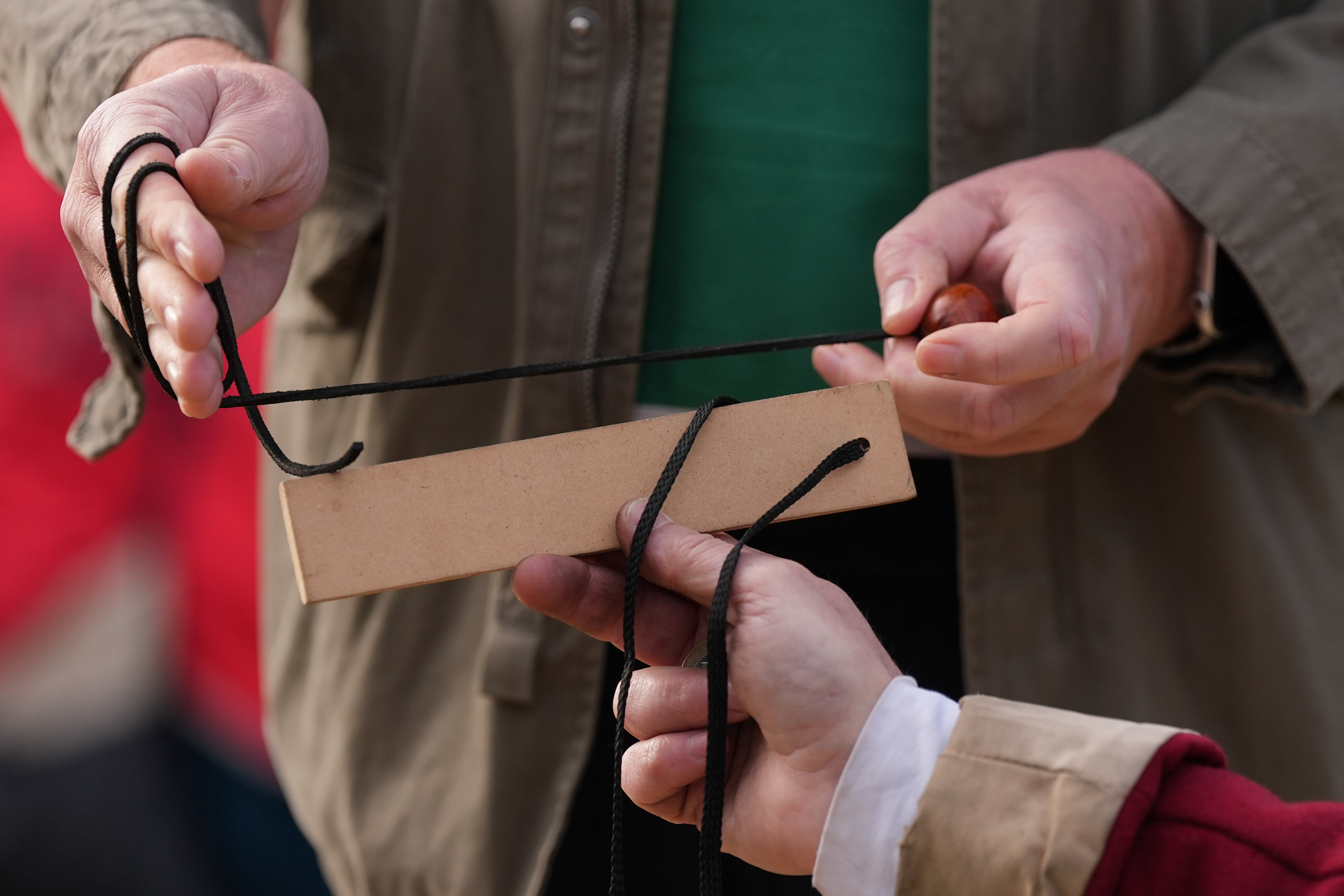 Conker string is measured as competitors take part in the annual event