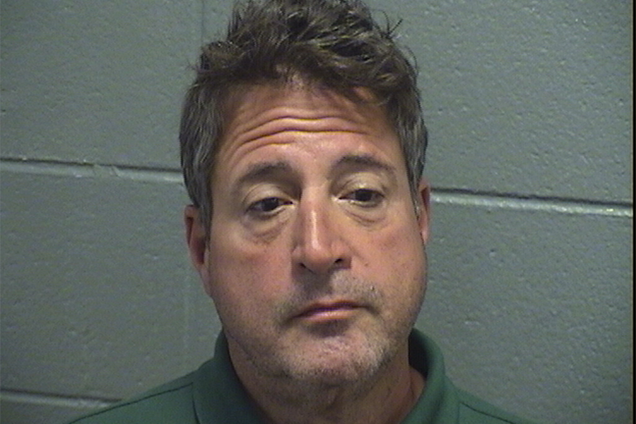 Denny Ellis, 57, was booked into Cook County Jail on suspicion of arson