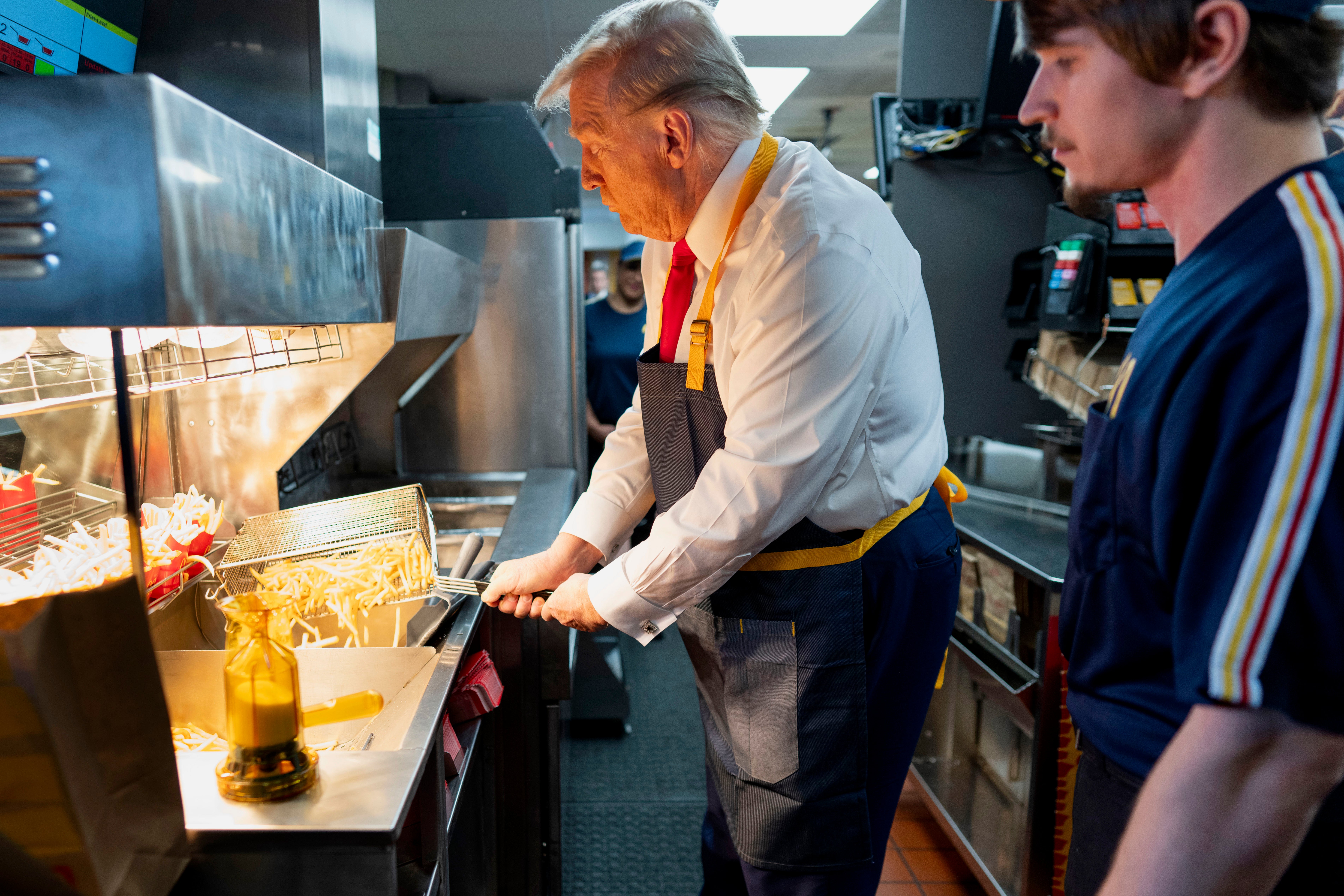 Trump is seen moving the fry baskets slowly and carefully using two hands, which is good technique that sticks to safety protocols