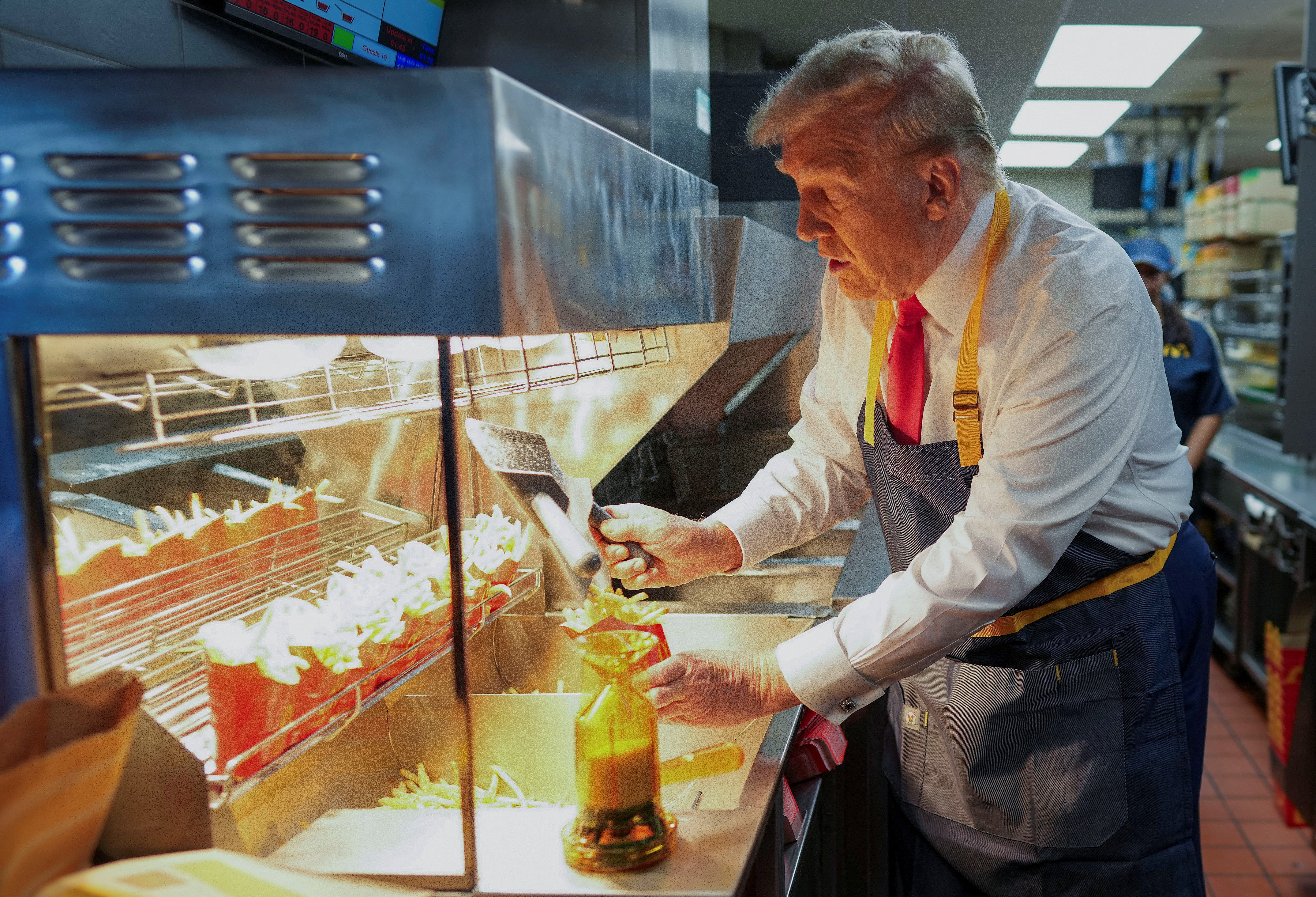 Trump works the fryer in a campaign stunt in Pennsylvania