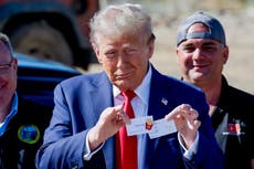 Trump shows off his McDonald’s fry cook pin while surveying hurricane-ravaged North Carolina