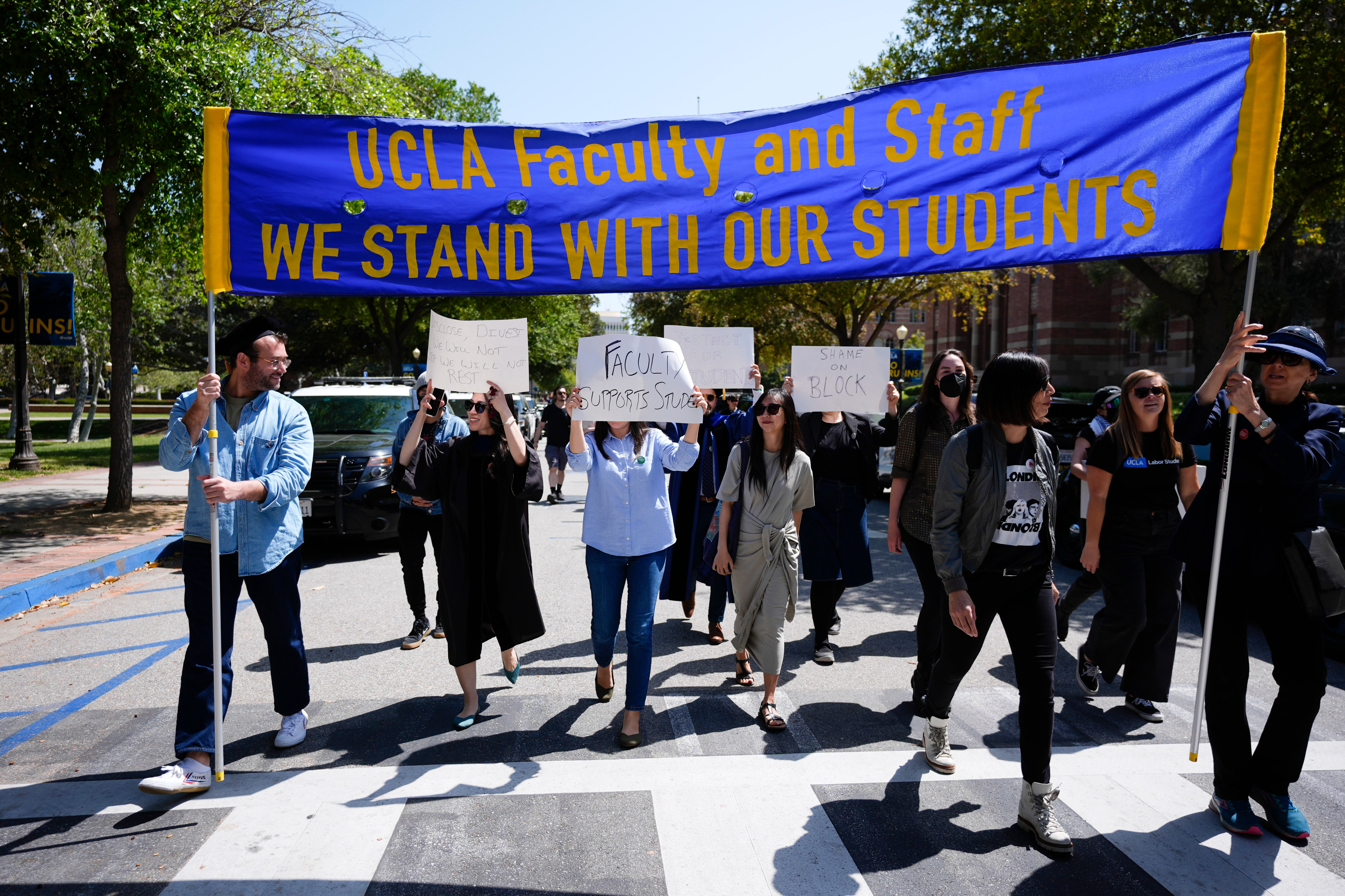 Faculty and staff march on the UCLA campus