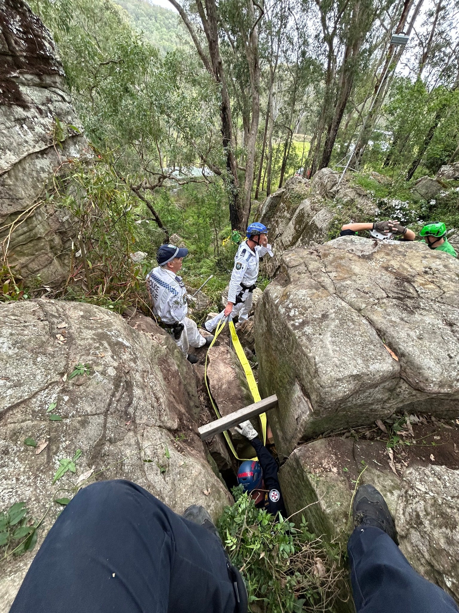 A woman was struck head-first for seven hours between two boulders in Australia