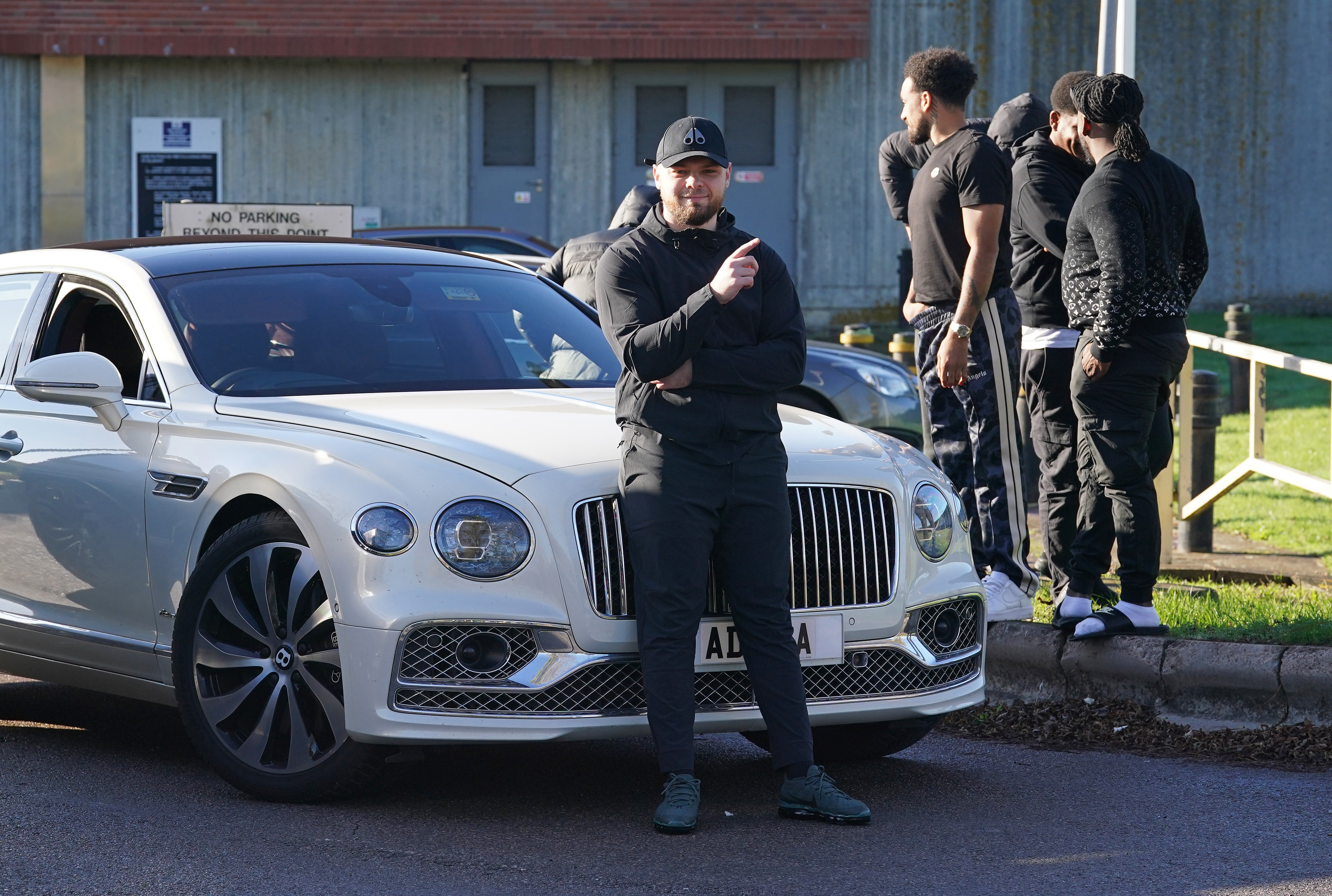 Dowling-Brooks poses in front of a white Bentley as he celebrates being released outside HM Prison Swaleside on the Isle of Sheppey, Kent