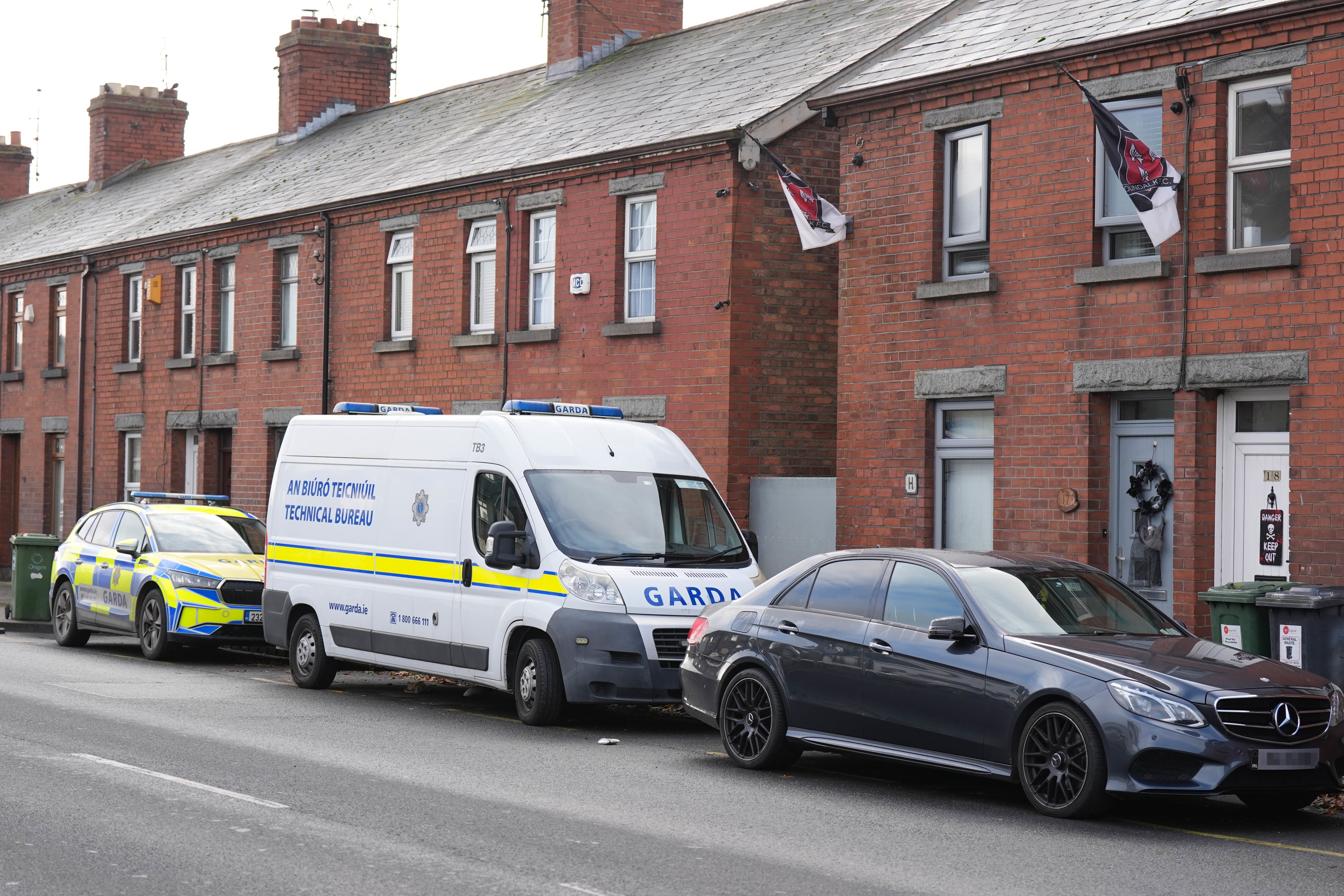 Gardai search a house in Dundalk, Co Louth, as part of the investigation into the suspected murder of eight-year-old Kyran Durnin (Niall Carson/PA)