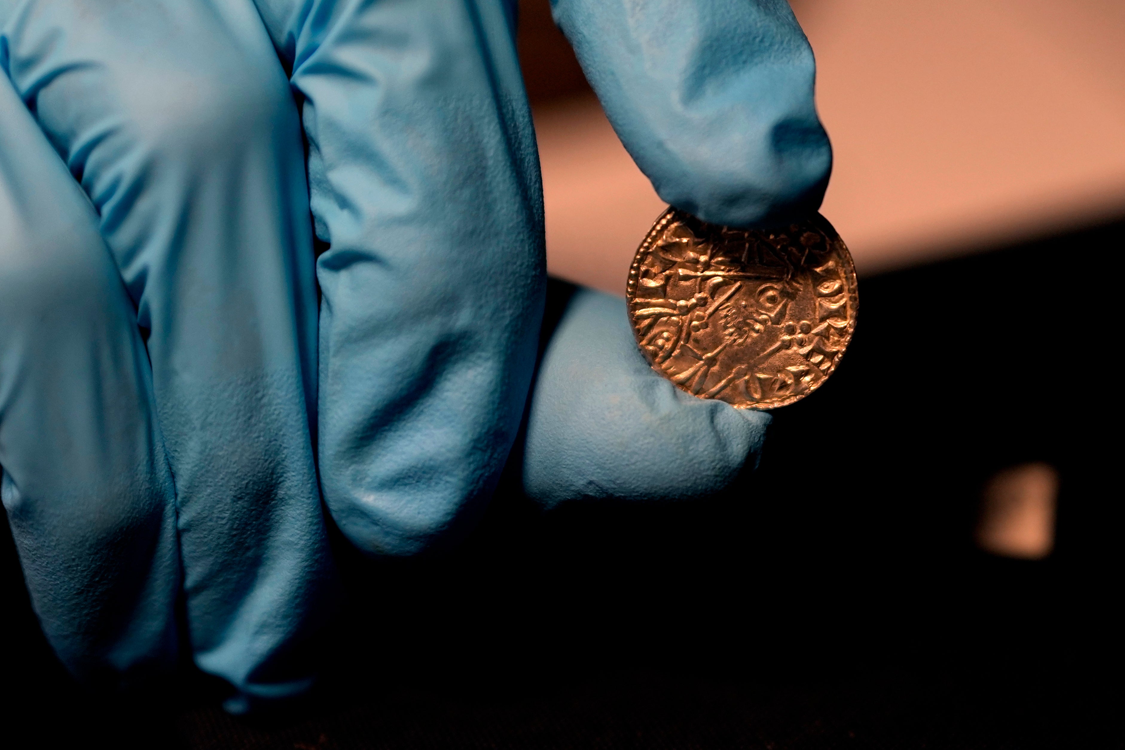 An Edward the Confessor Pyramid coin (1065-6), part of the Chew Valley Hoard of 2,584 coins, buried in the turmoil following the Norman Invasion of Britain in 1066, on display at the British Museum in London