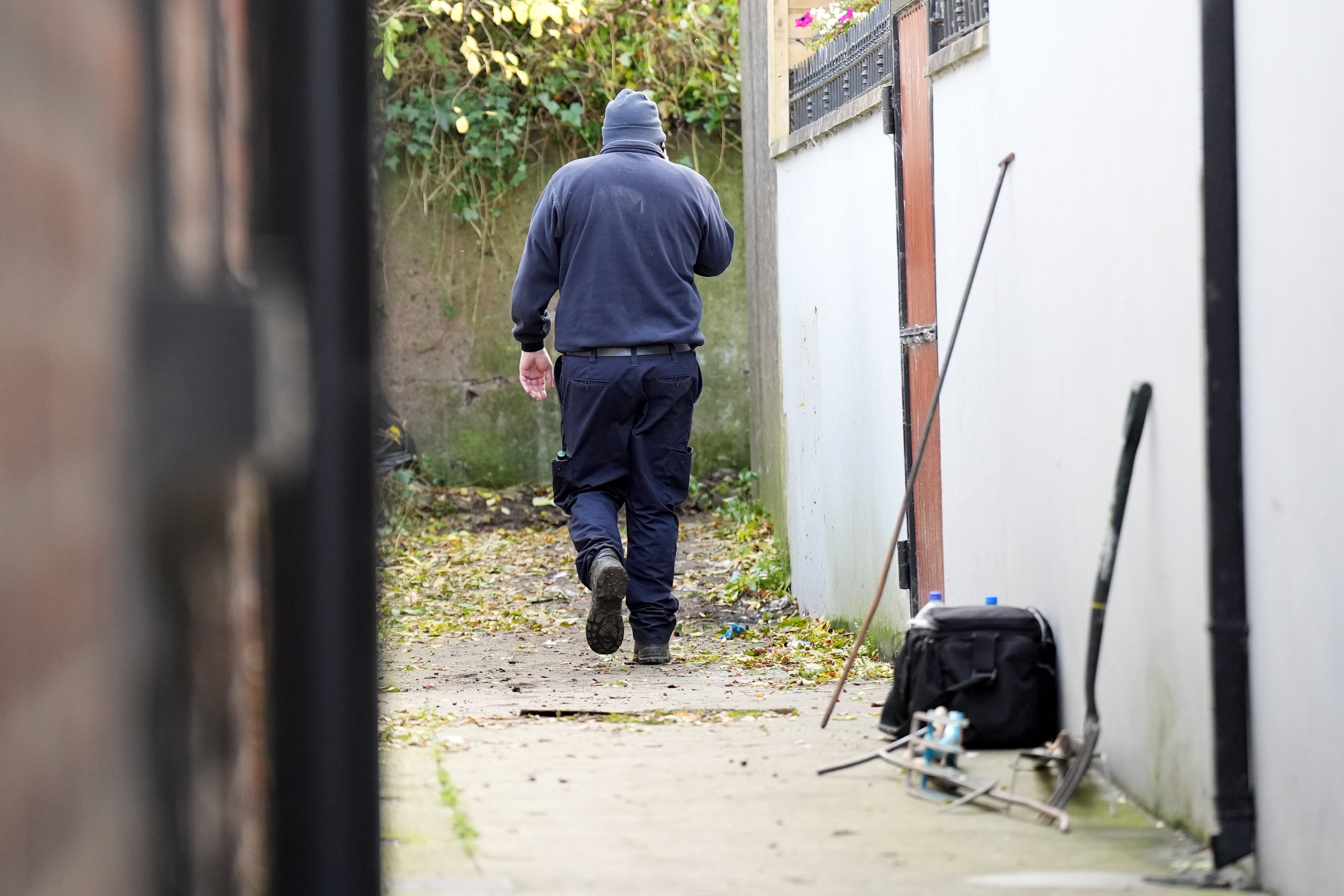 A member of the Gardai search team at the property