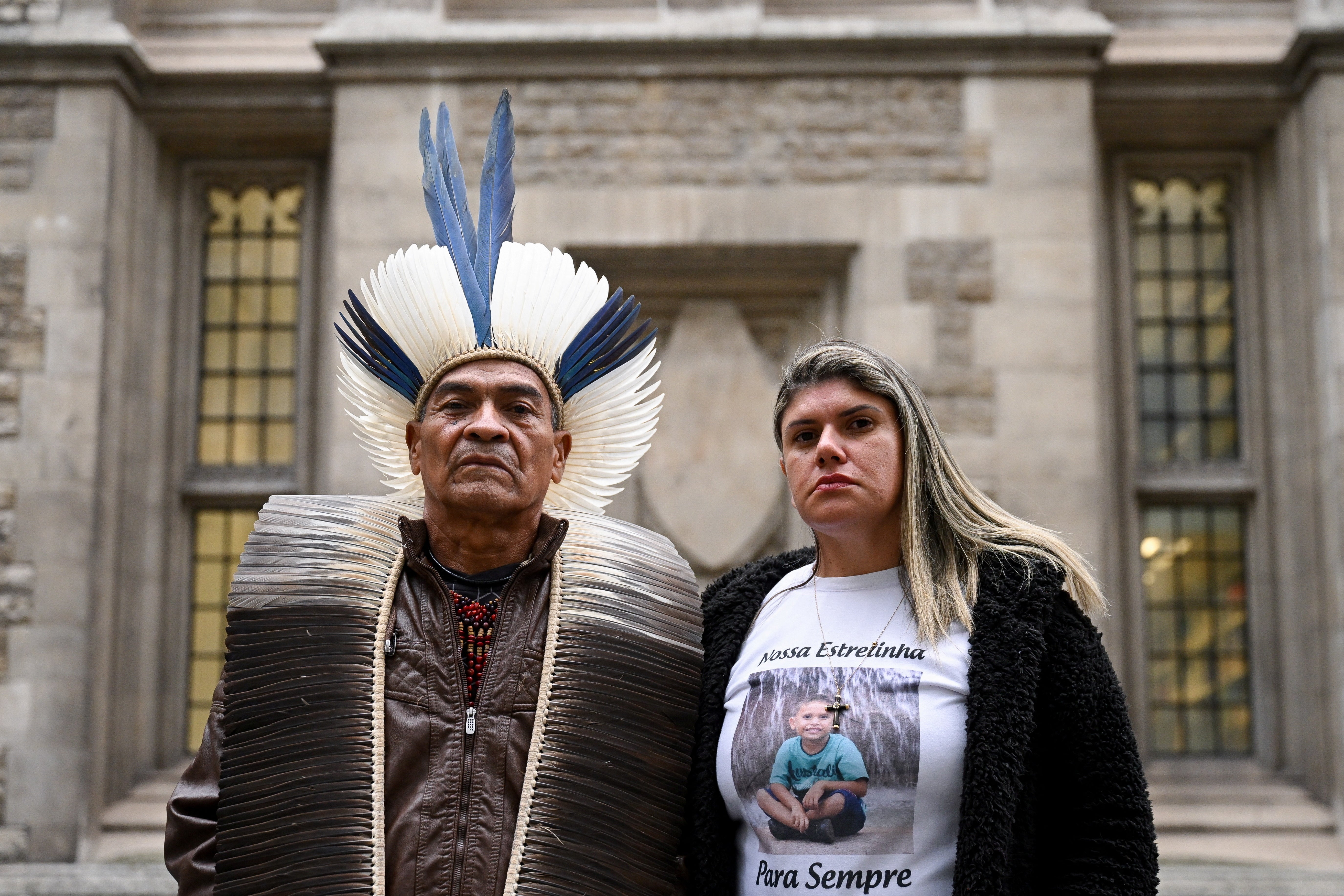 Cacique Bayara, leader of the Pataxo Geru-Tucuna village, and Gelvana Rodrigues, wearing a T-shirt with an image of her son Thiago