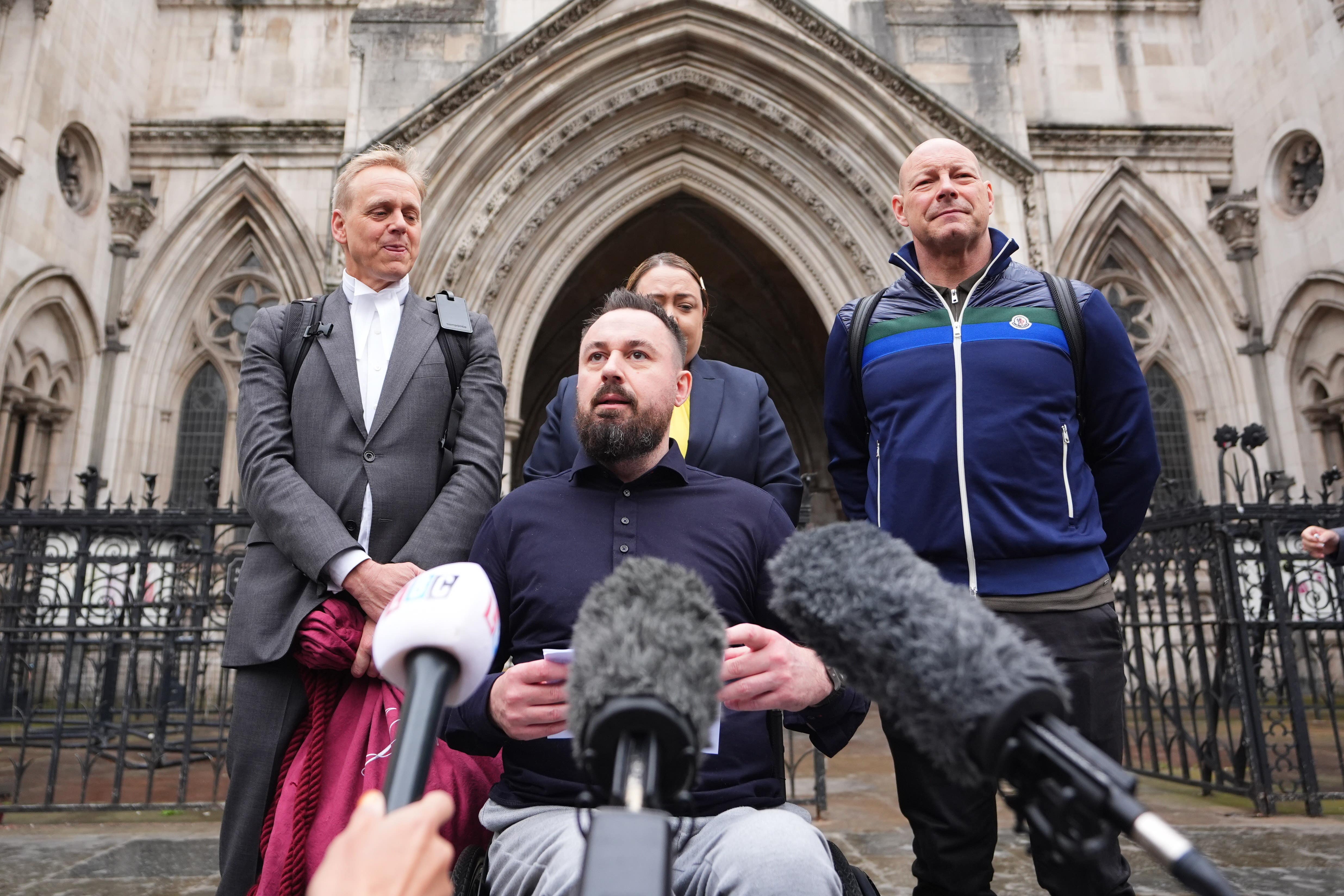 Martin Hibbert (centre), who was injured in the May 2017 Manchester Arena bombing (James Manning/PA)