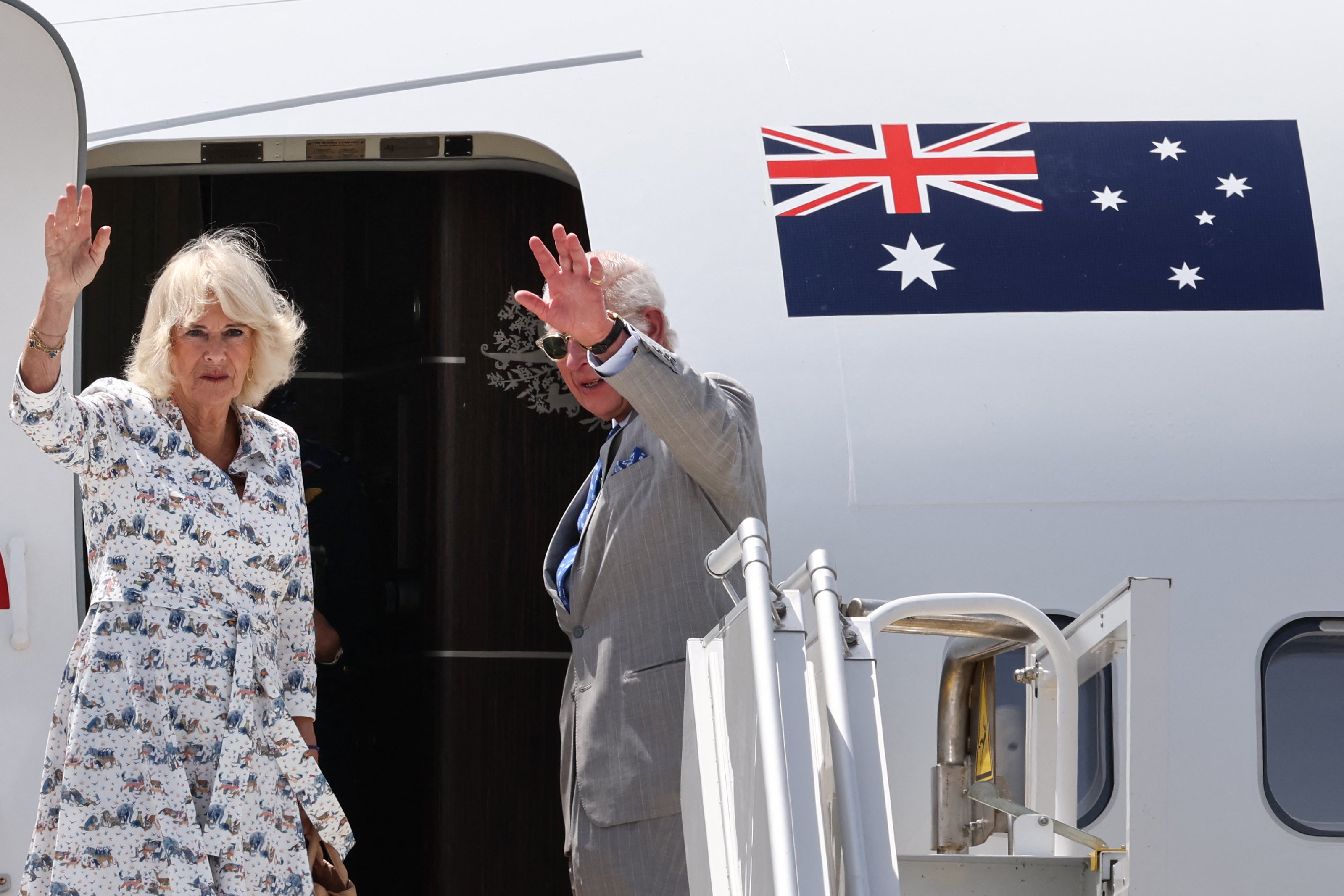 Britain’s King Charles III and Queen Camilla wave as they depart from Sydney Airport in Sydney on 23 October 2024, after a six-day royal visit to Sydney and Canberra