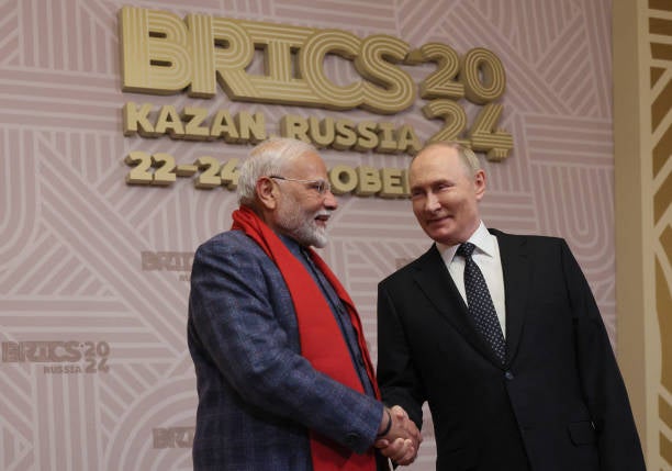 Russian president Vladimir Putin greets Indian prime minister Narendra Modi during a welcoming ceremony for participants of the Brics summit in Kazan