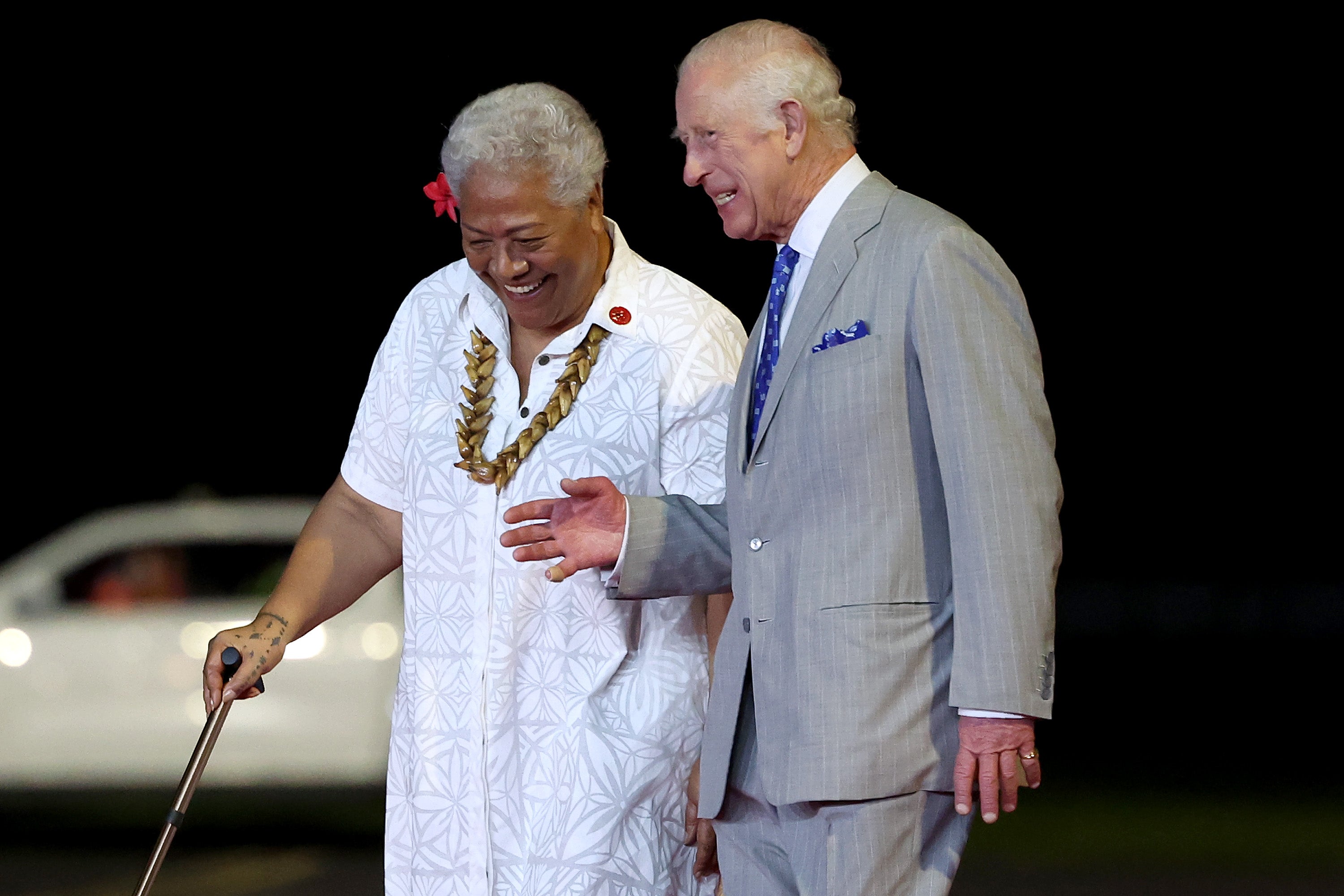 King Charles III walks with prime minister of Samoa Fiame Naomi Mata’afa after arriving at Faleolo International Airport for his official welcome on 23 October 2024