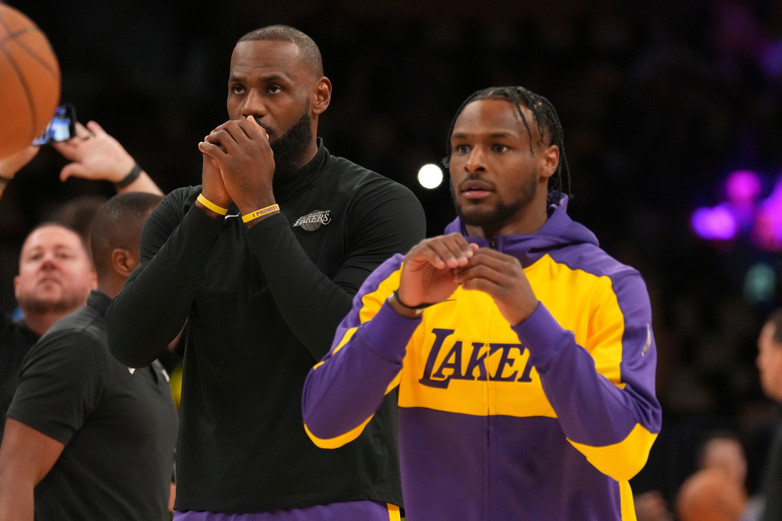 The James duo warmed up together before the game