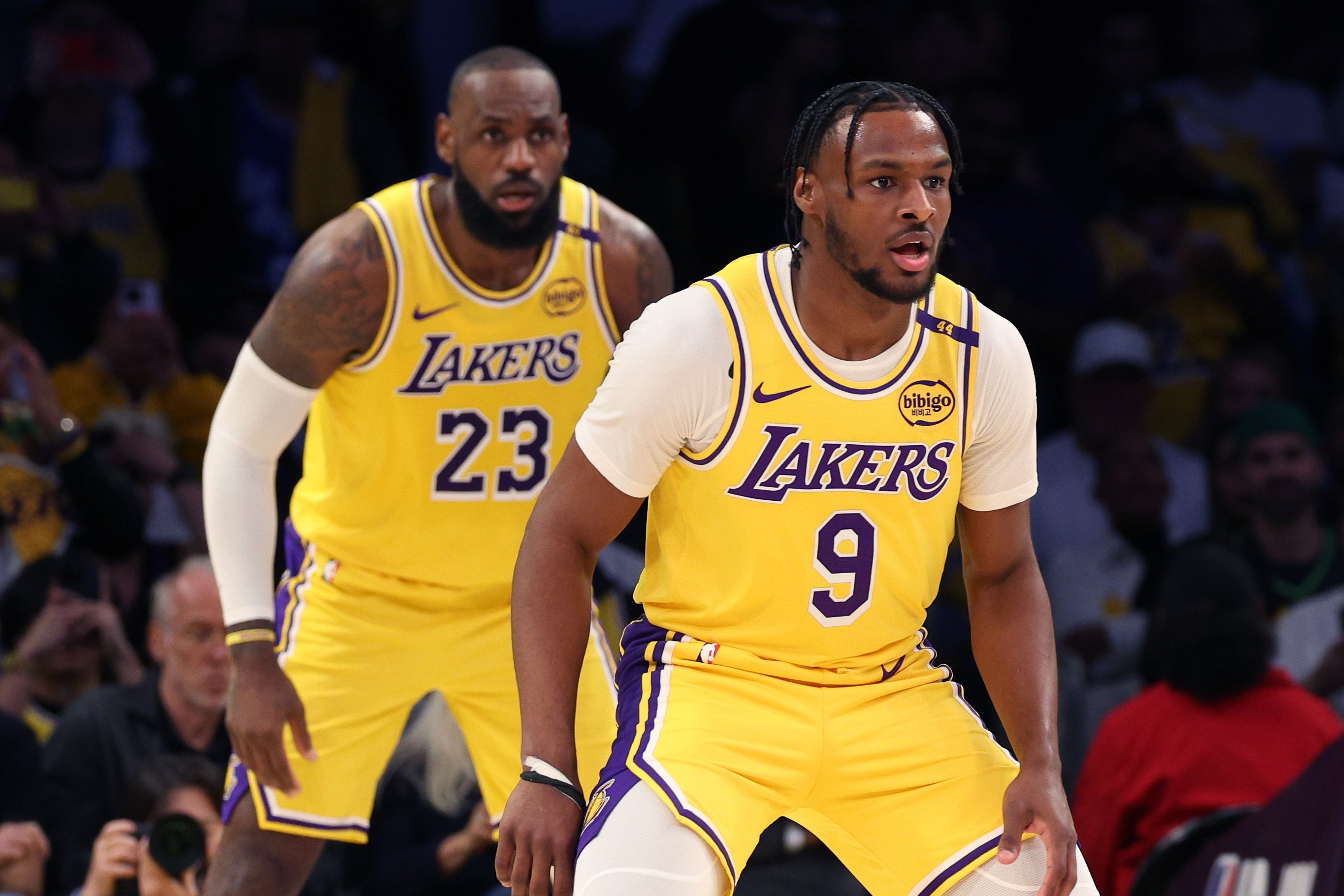 Bronny James (front) stepped on the court in the second quarter to play alongside his dad LeBron (back) during the LA Lakers’s season opener