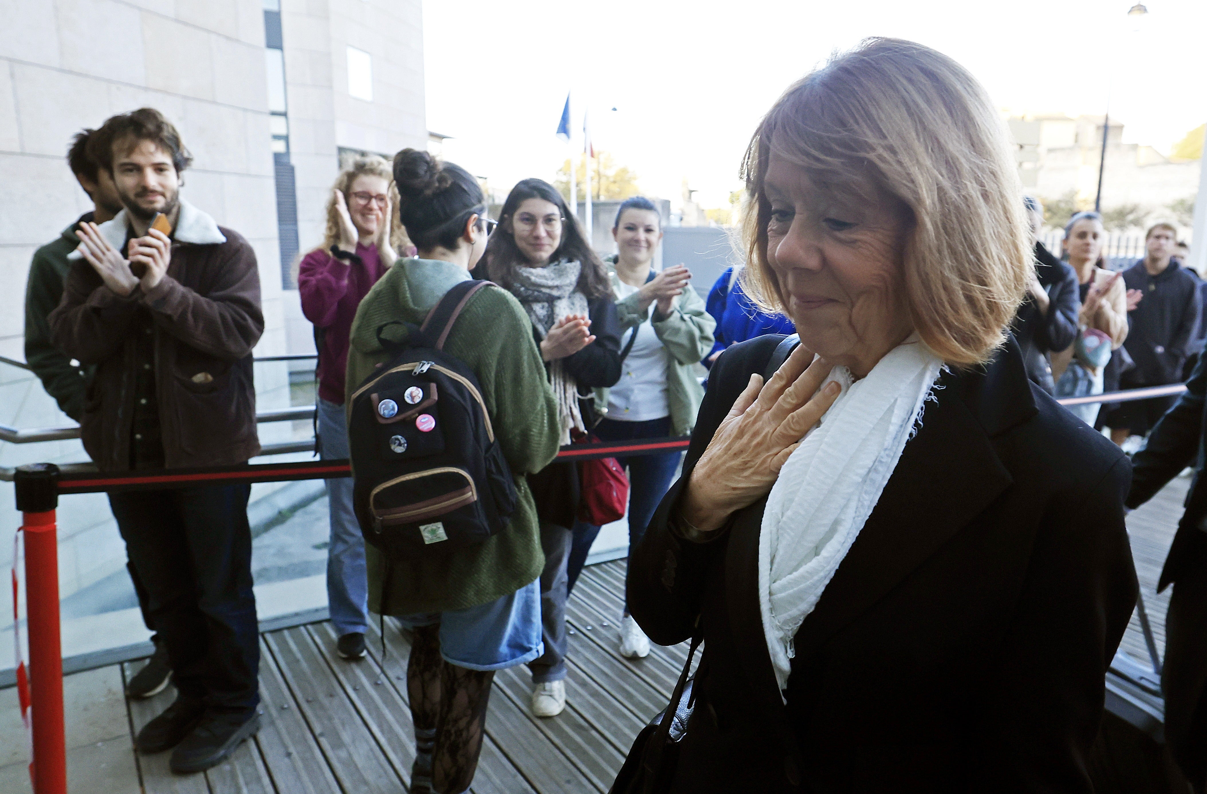 Gisele Pelicot (R) arrives at the criminal court in Avignon, France, 23 October 2024