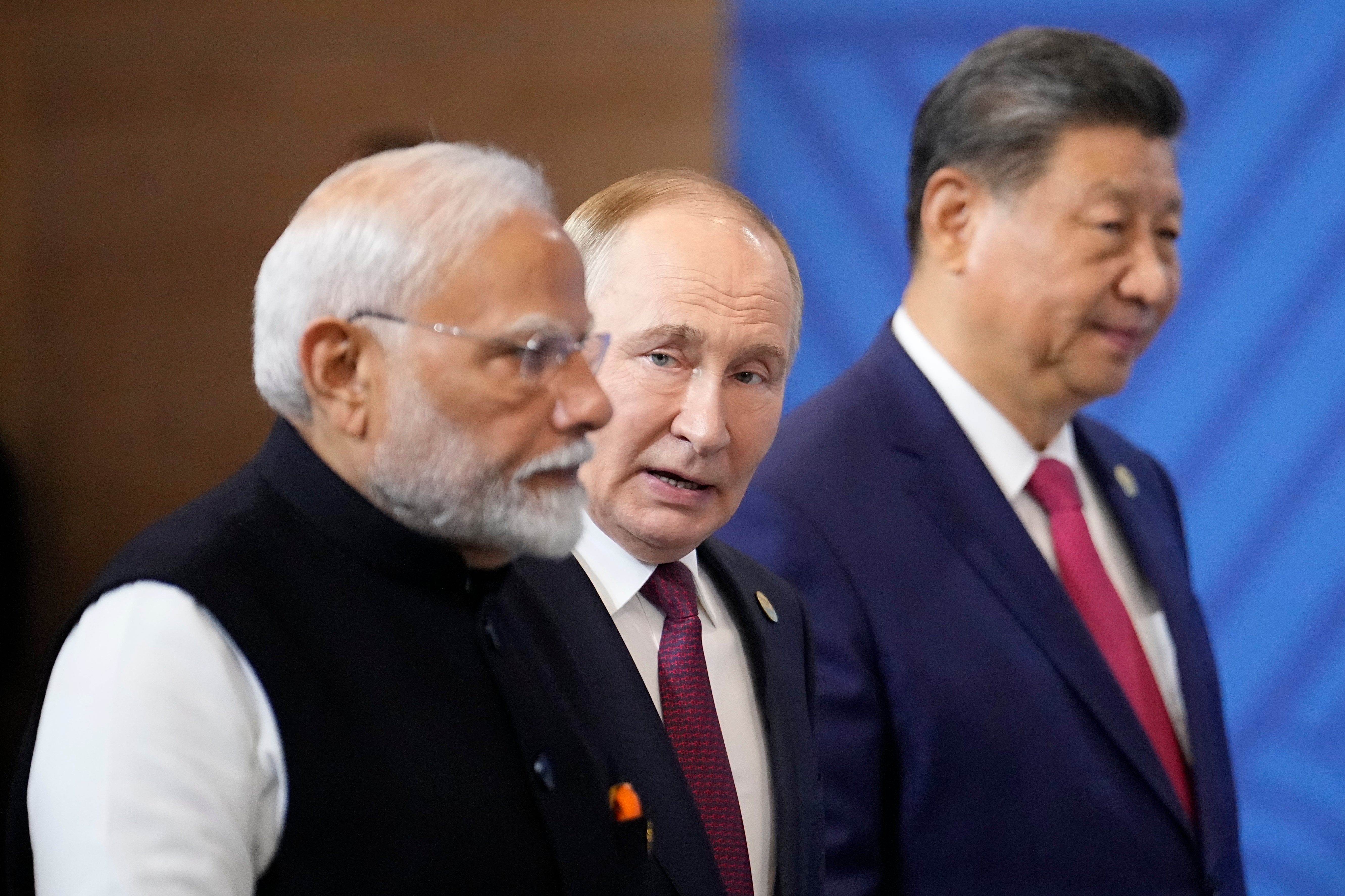 Narendra Modi, Vladimir Putin and Xi Jinping attend a photo ceremony on the sidelines of the Brics summit