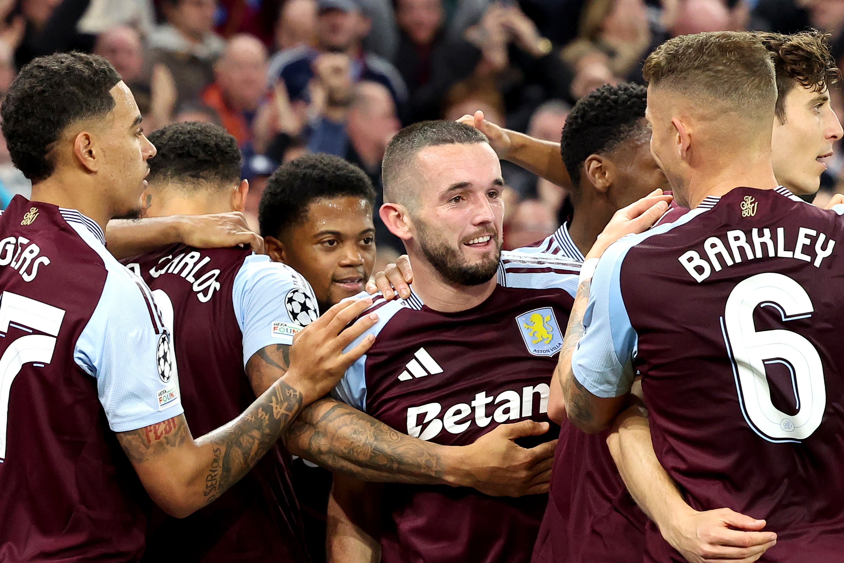 John McGinn of Aston Villa celebrates with teammates after scoring