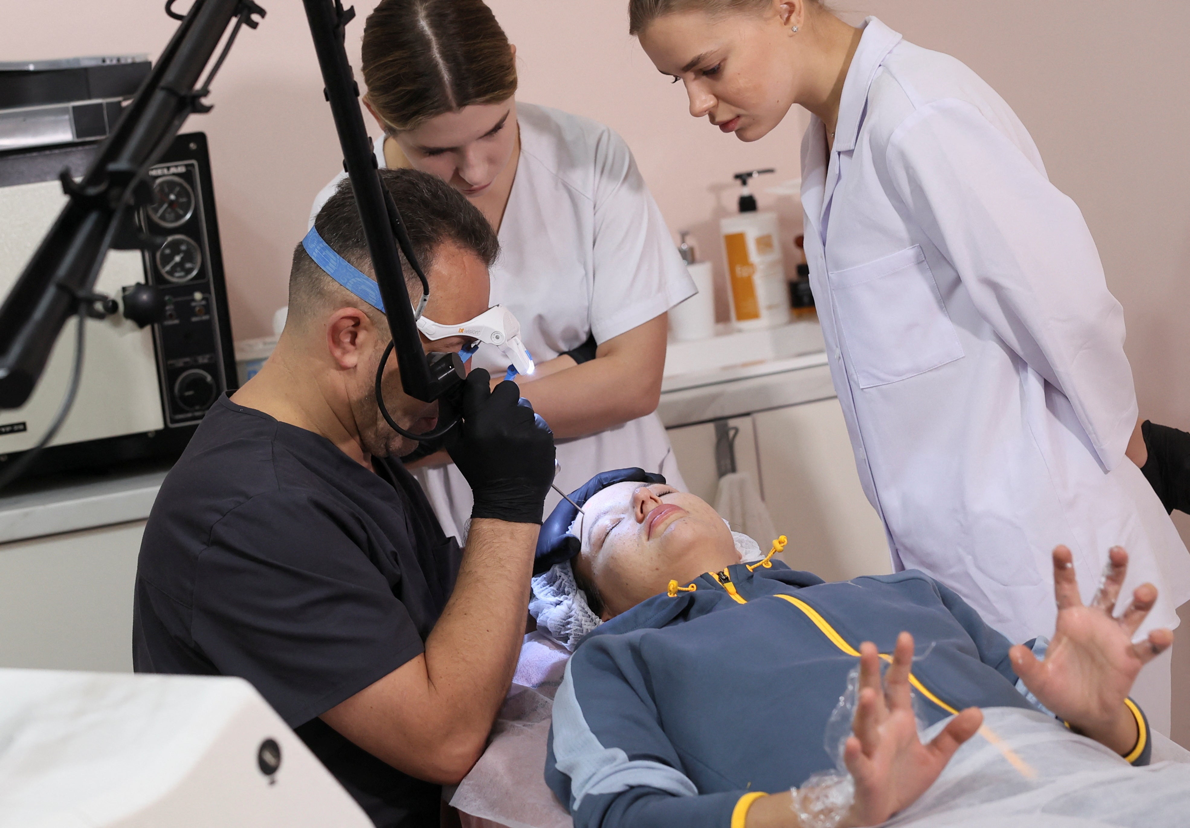 Yana Zalevska, 23-years-old, a former Ukrainian service member, who was wounded at a front line, attends a medical procedure in a clinic, which treats scars in Lviv, western Ukraine