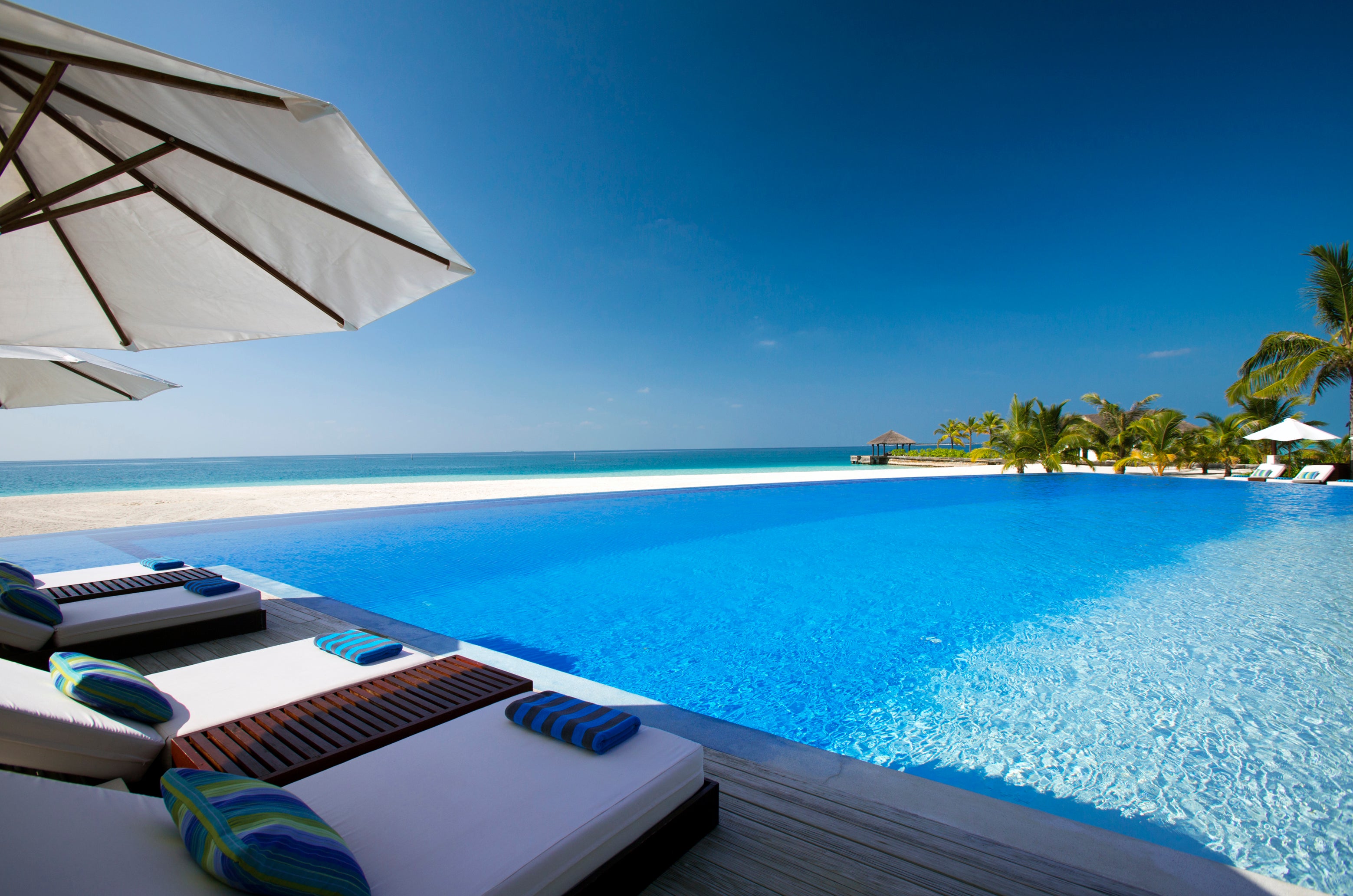 Crystal clear waters The infinity pool at Velassaru Maldives