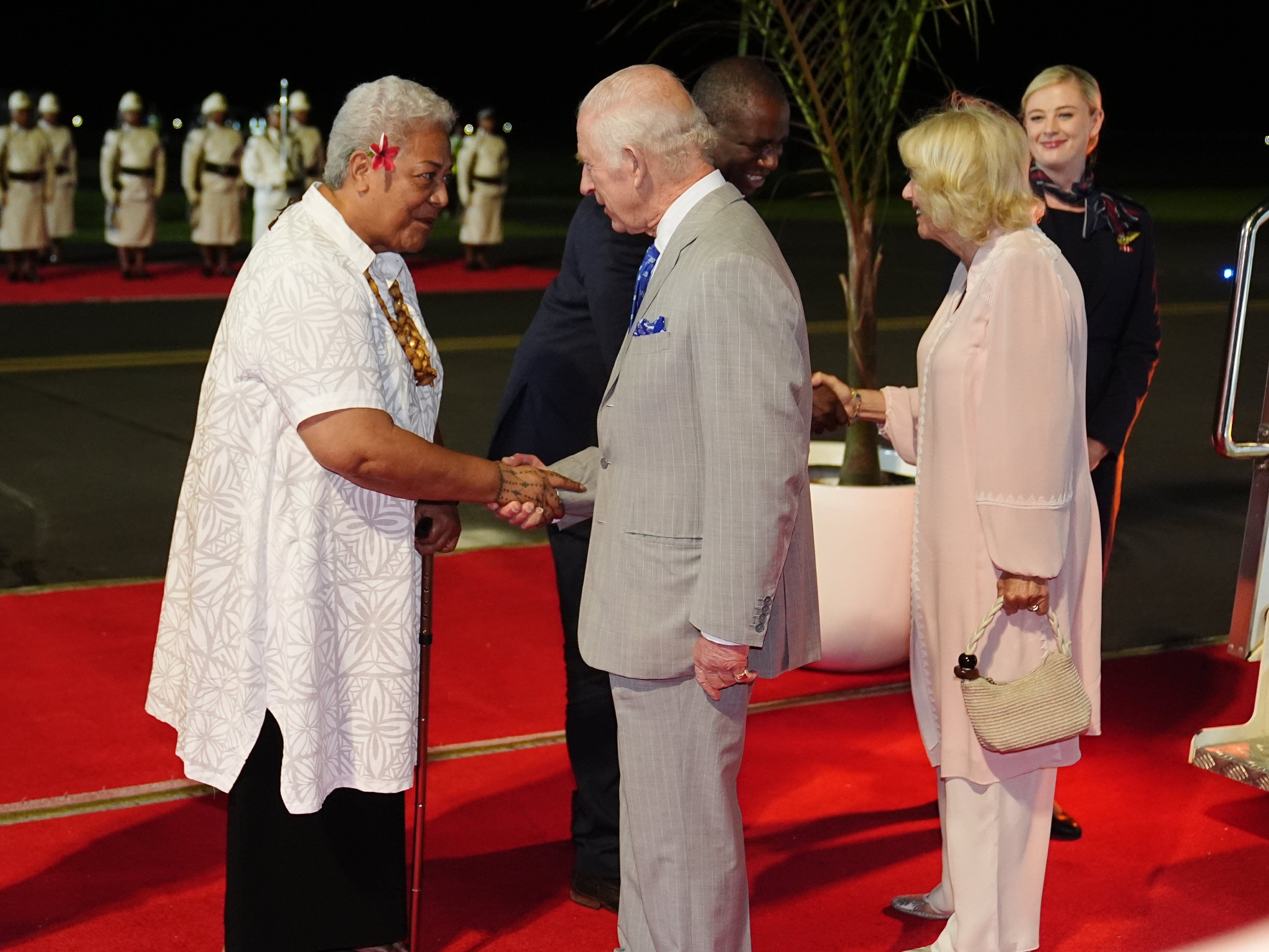 King Charles and Queen Camilla meet Samoa’s prime minister Fiame Naomi Mataʻafa as they arrive for the CHOGM summit on Wednesday