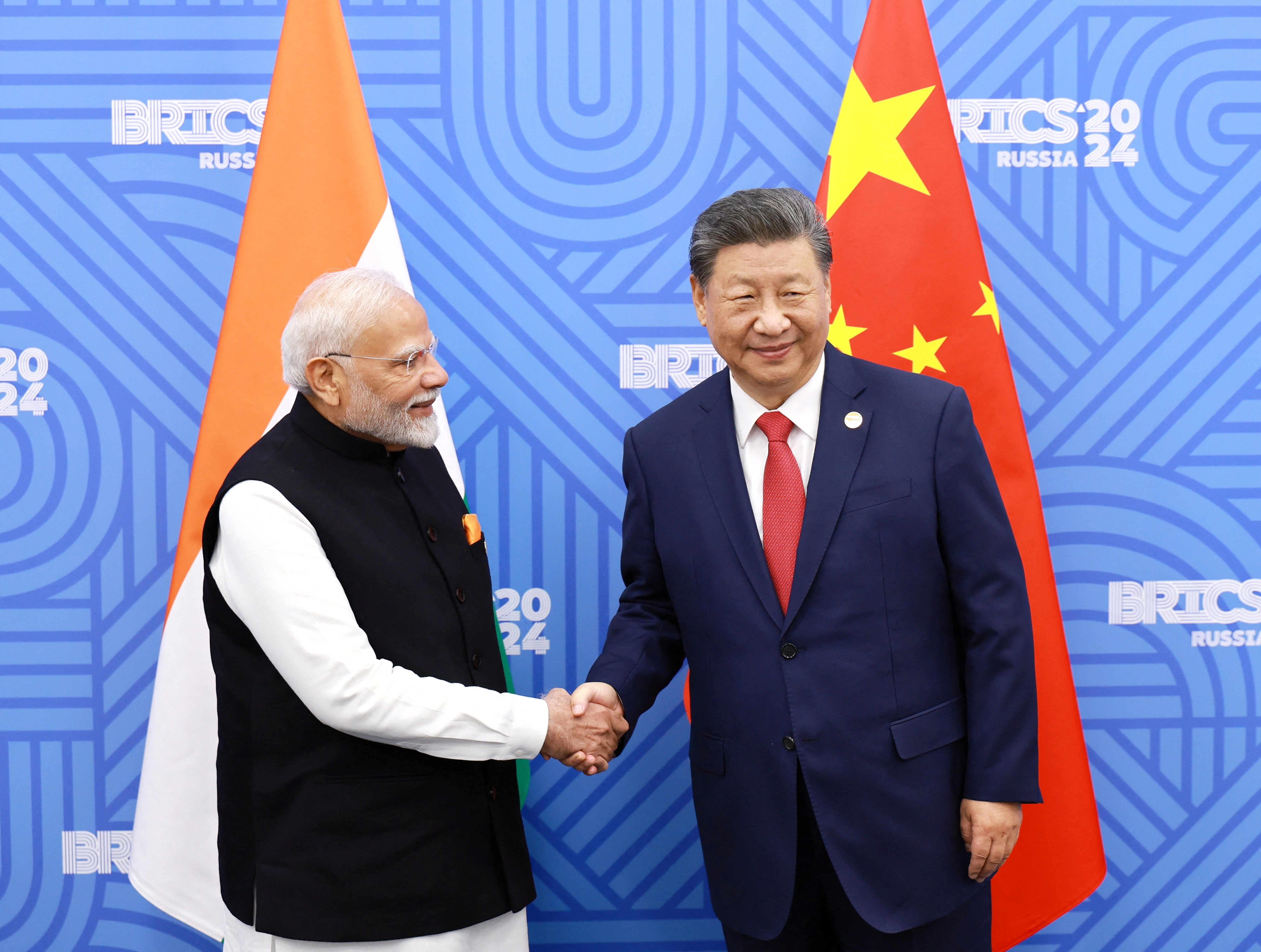 Chinese President Xi Jinping and India Prime Minister Narendra Modi meet on the sidelines of the Brics summit in Kazan, Russia