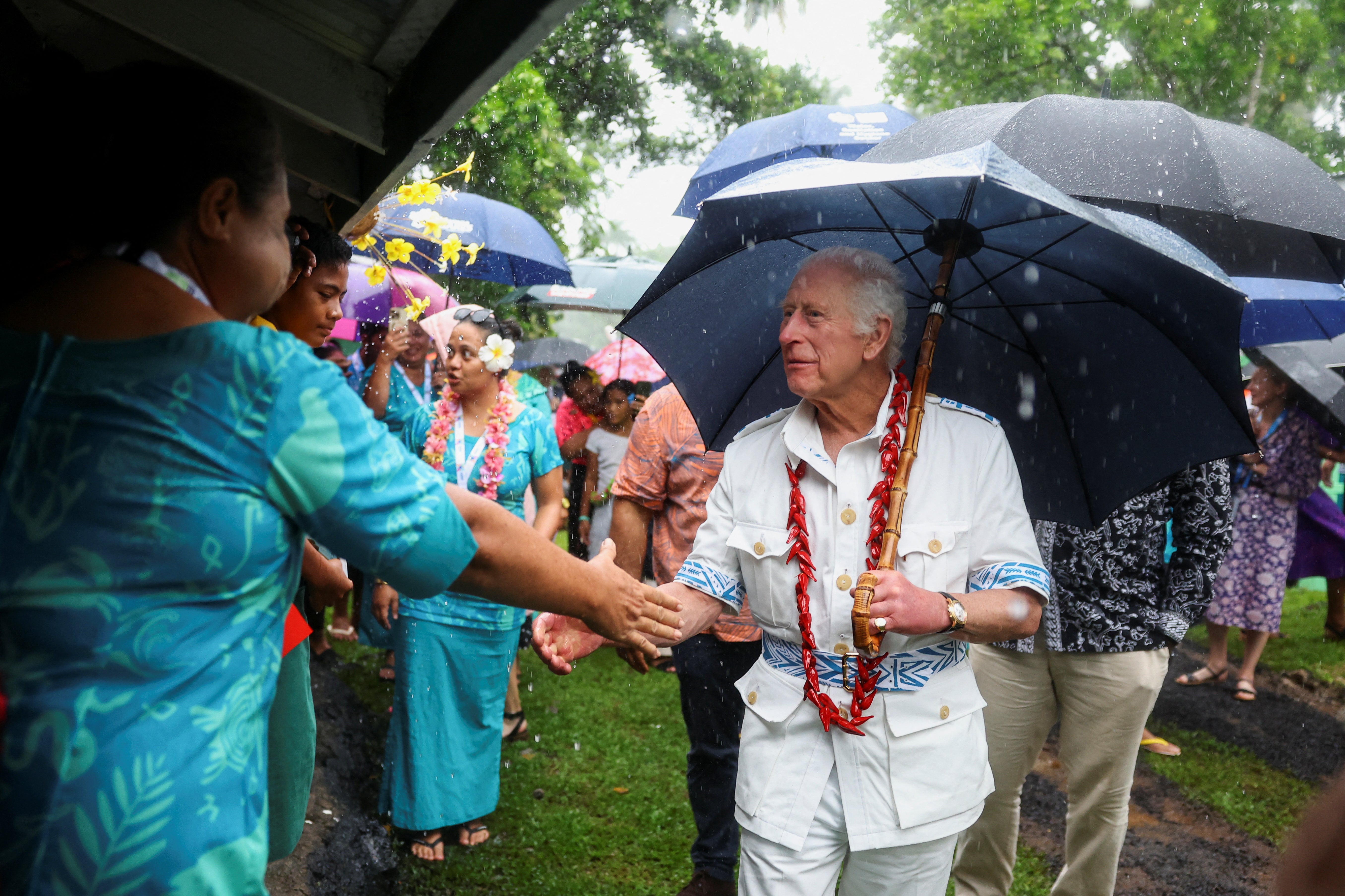 King Charles meets villagers and community groups involved in the reforestation efforts at O Le Pupu’Pue National Park, in Sa’agafou, Samoa, 24 October 2024