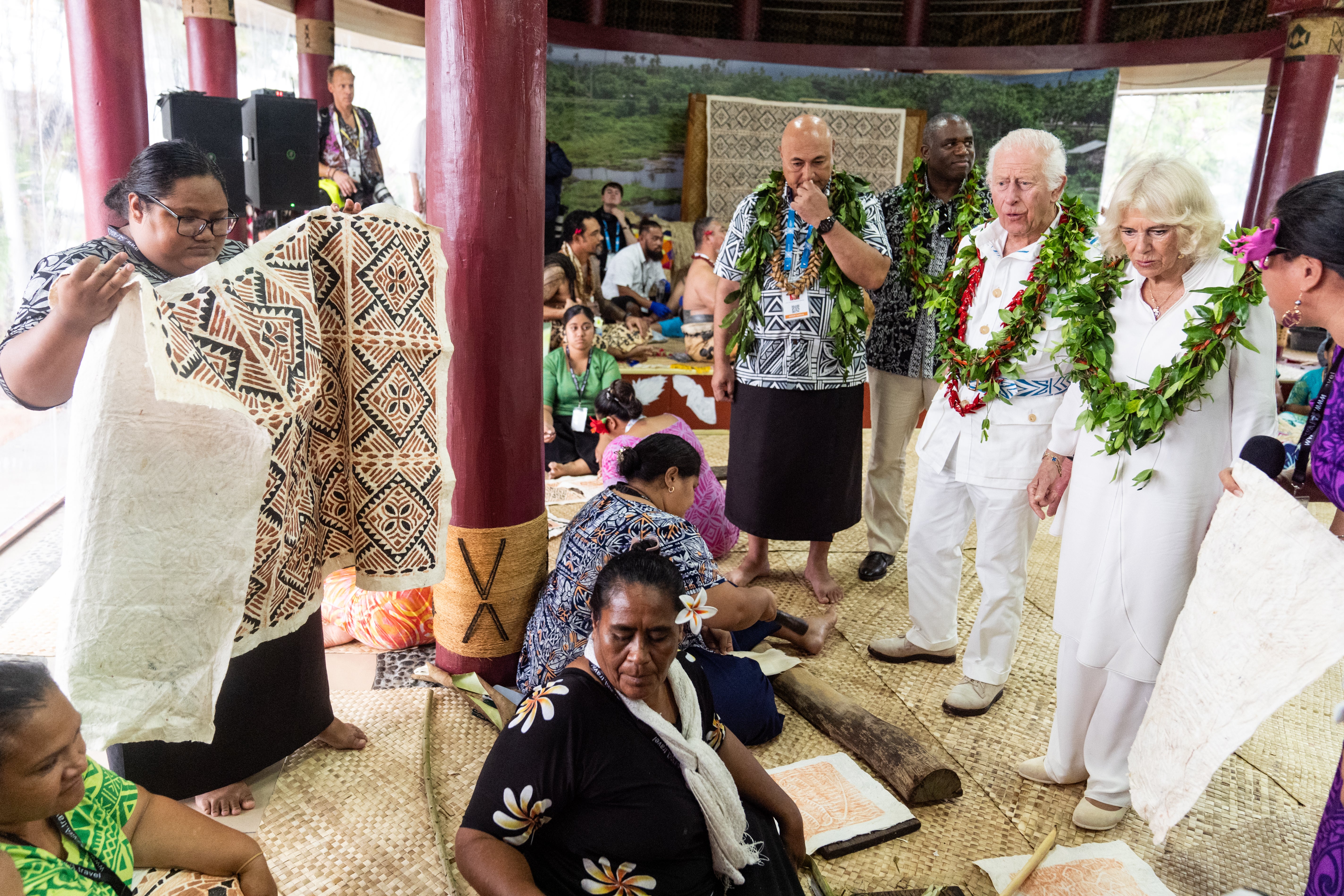 King Charles and Queen Camilla during a visit to the Samoan Cultural Village in Apia