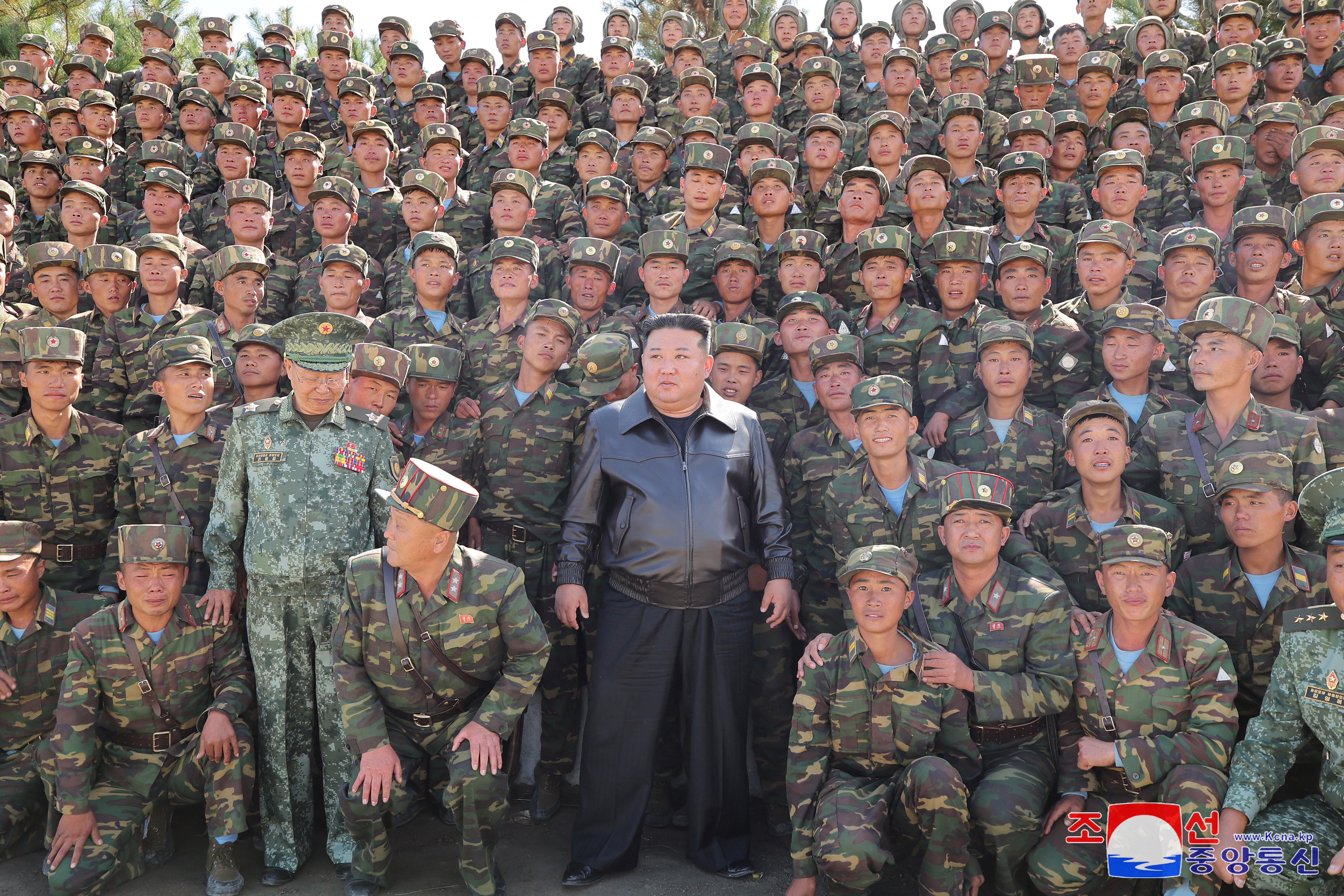 This picture taken on October 2, 2024 and released from North Korea's official Korean Central News Agency (KCNA) via KNS on October 4, 2024 shows North Korea's leader Kim Jong Un (C) posing with troops during an inspection at a training base of the Korean People's Army's special operations forces in the western region, at an undisclosed location in North Korea