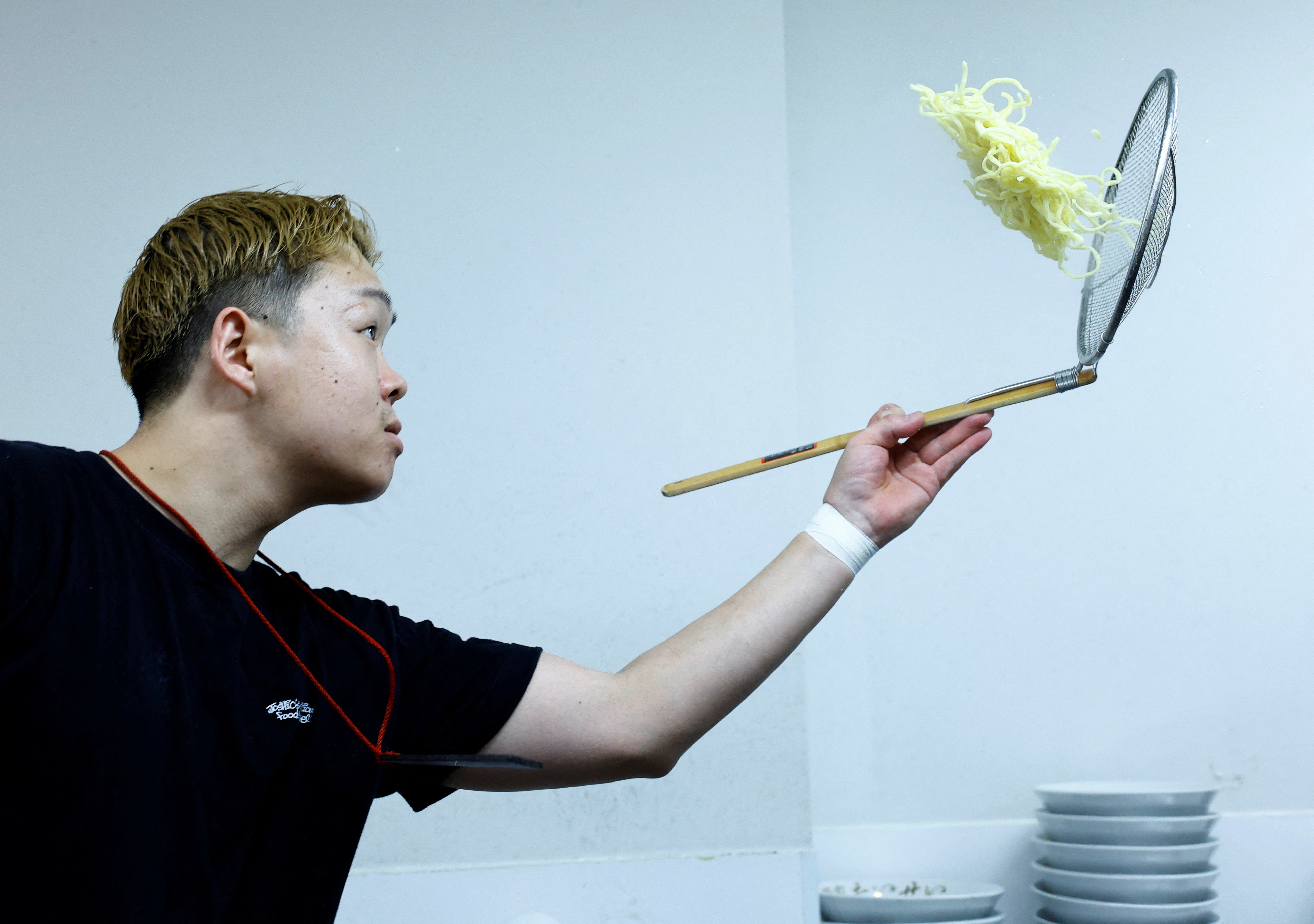 Ramen shop Menya Taisei's owner Taisei Hikage cooks ramen at his shop in Tokyo, Japan