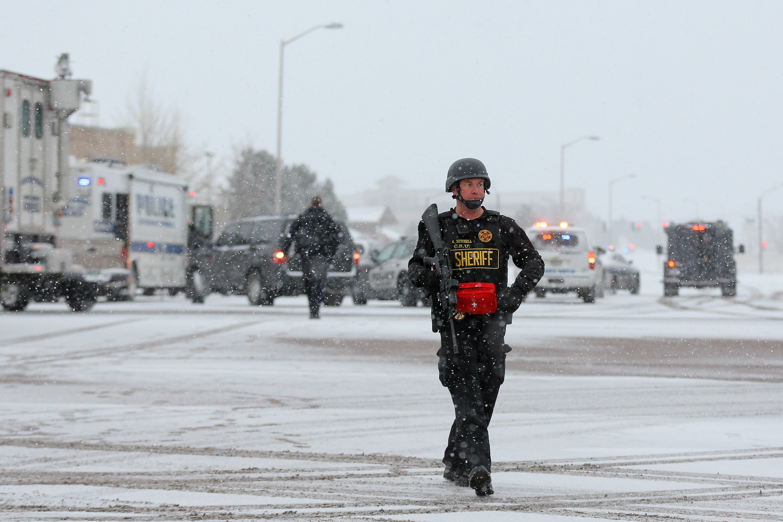 An officer waits after reports of a shooting at a Planned Parenthood clinic in Colorado Springs