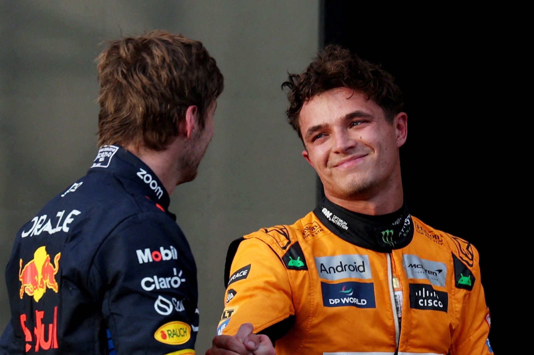 McLaren’s Lando Norris (right) speaks to Red Bull’s Max Verstappen