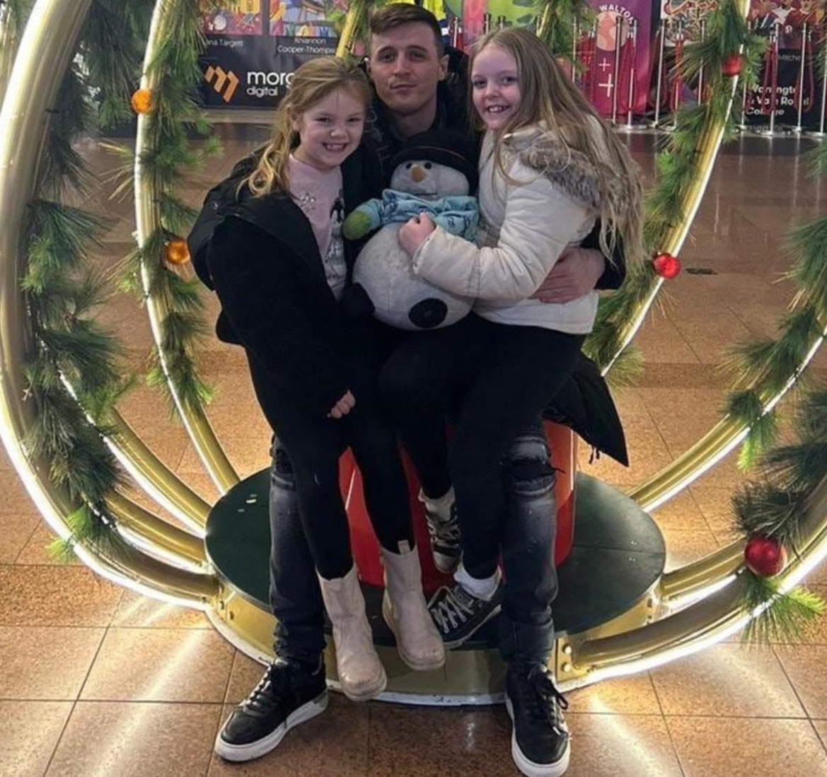 Father Matthew Booth, 33, with his daughters Ava, 10, and Madison, seven