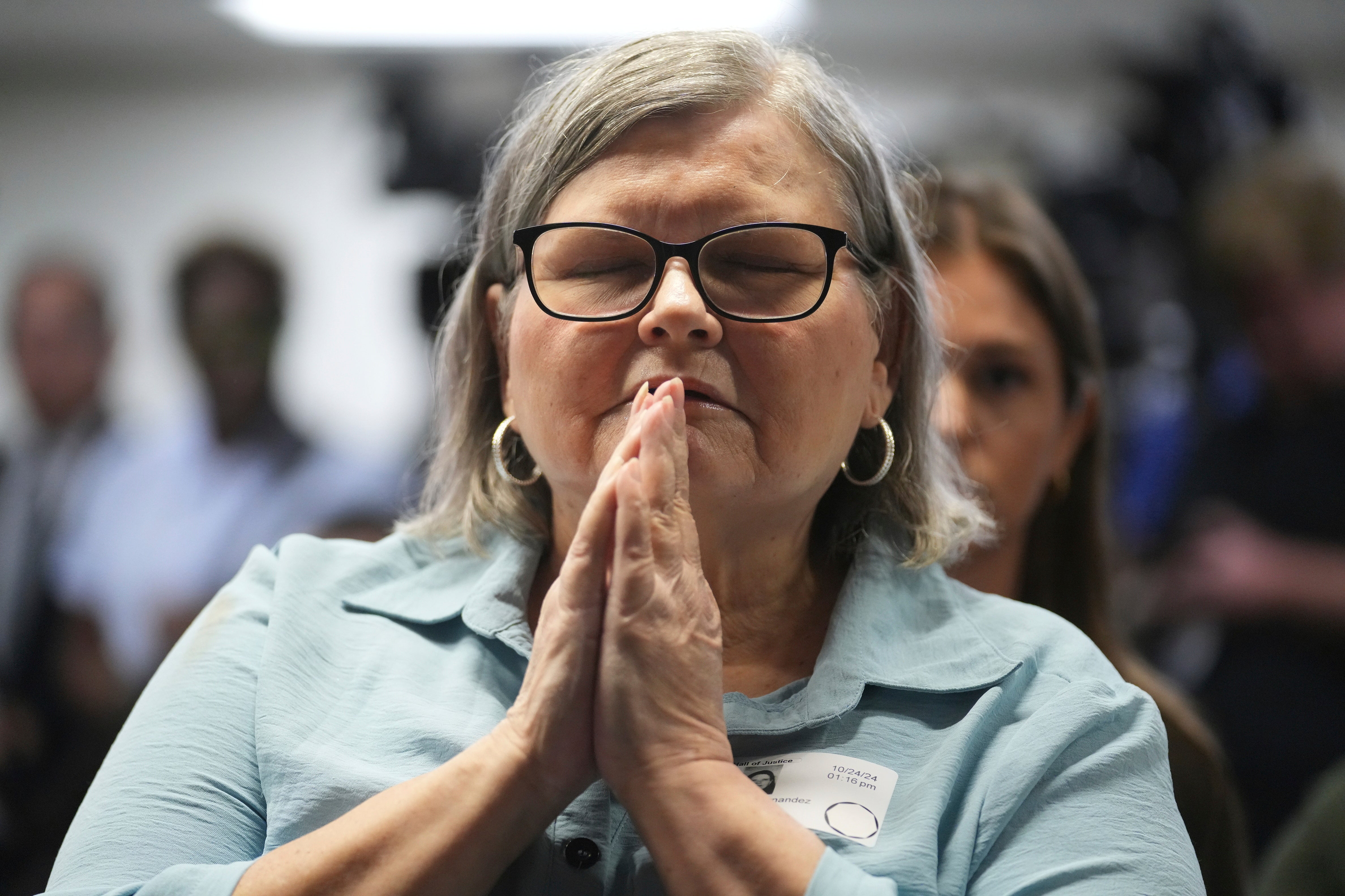 Diane Hernandez, niece of Kitty Menendez , reacts to a news conference being held by Los Angeles County District Attorney George Gascon at the Hall of Justice on Thursday