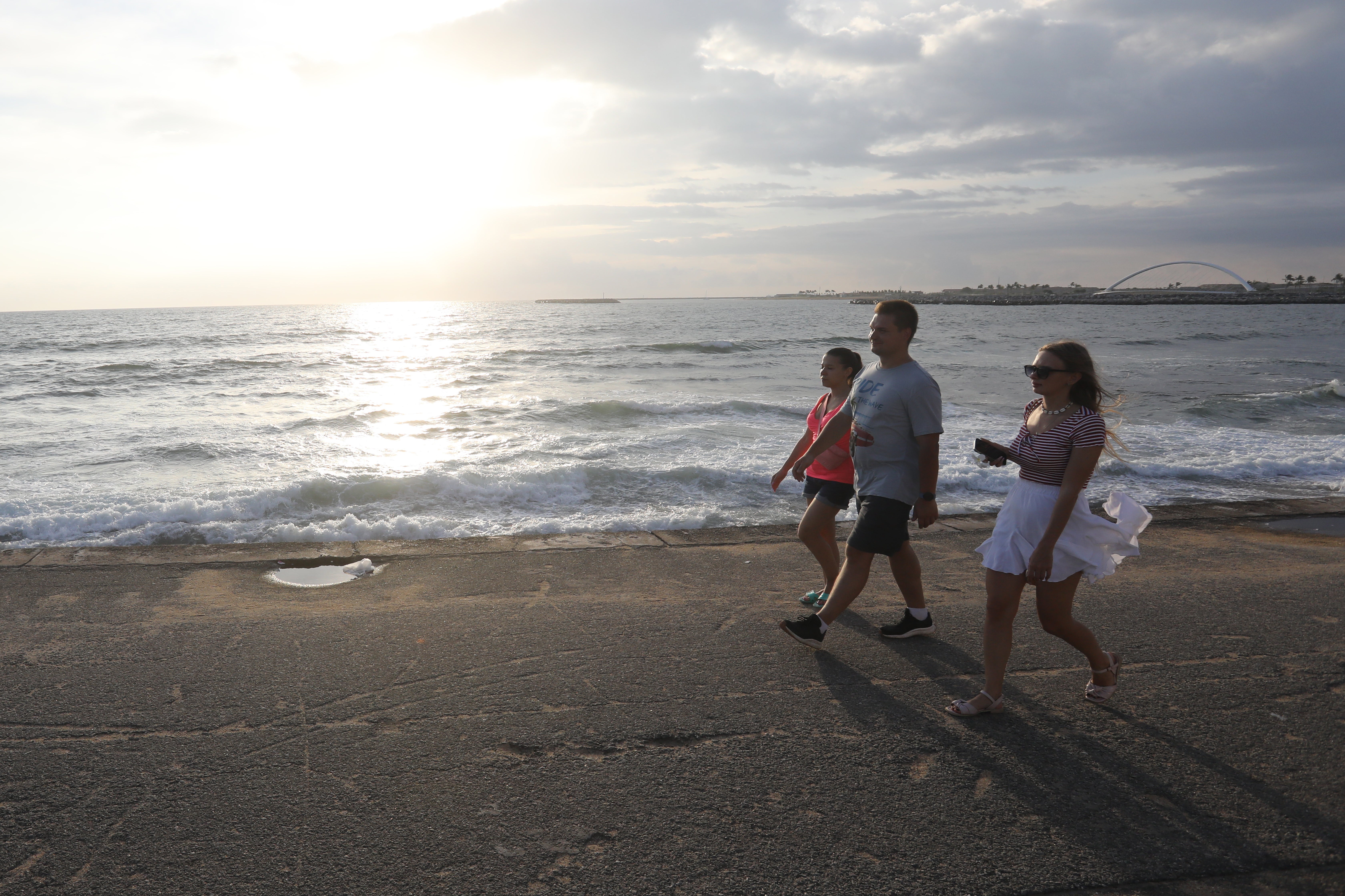 Foreign tourists spend the evening at the Galle Face beachfront in Colombo, Sri Lanka