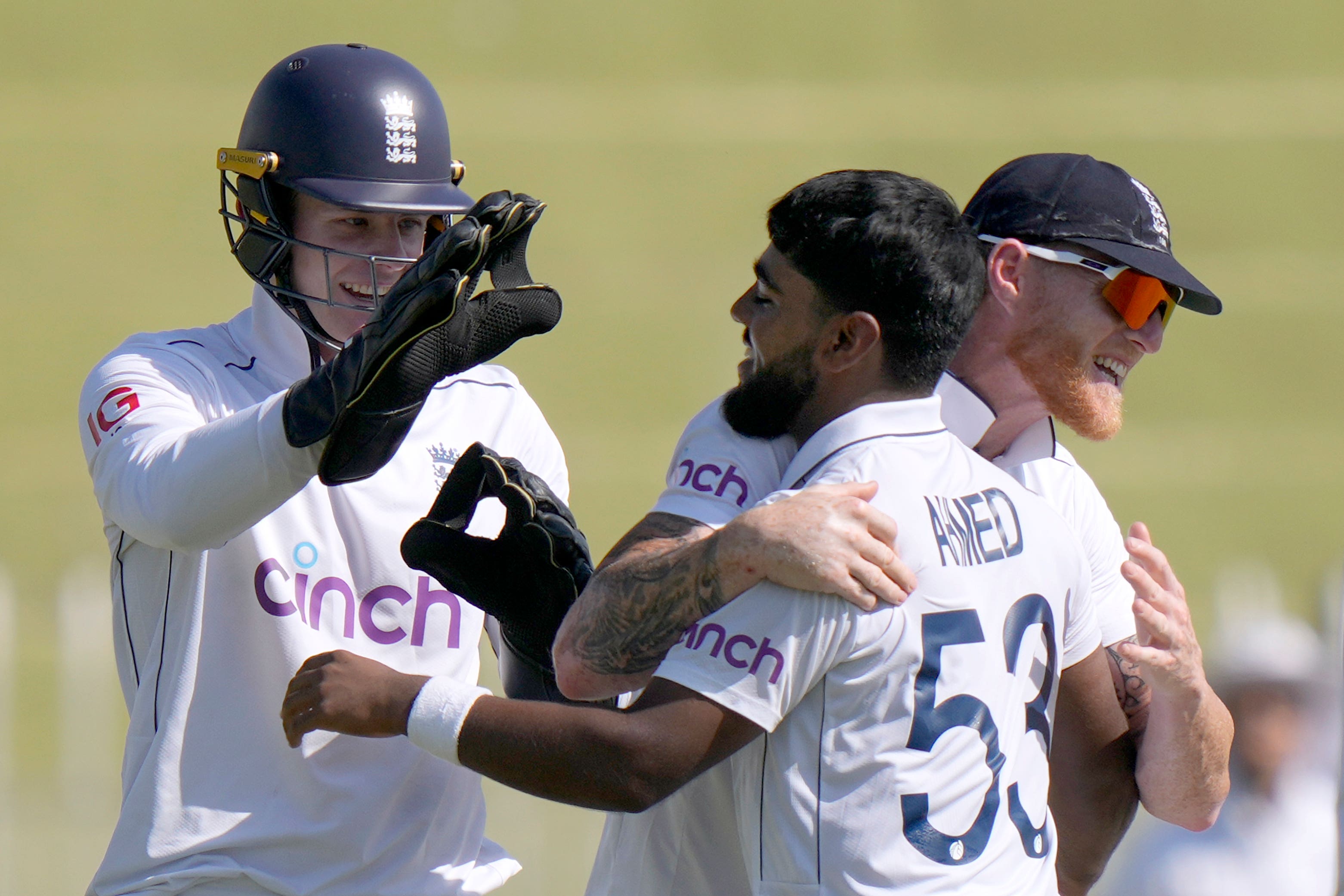 Rehan Ahmed, centre, starred for England with the ball (Anjum Naveed/AP)