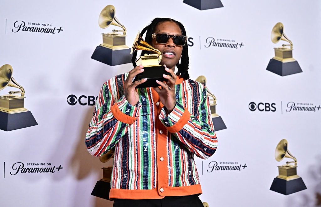 Lil Durk poses in the press room with the Grammy for Best Melodic Rap Performance for "All My Life" during the 66th Annual Grammy Awards