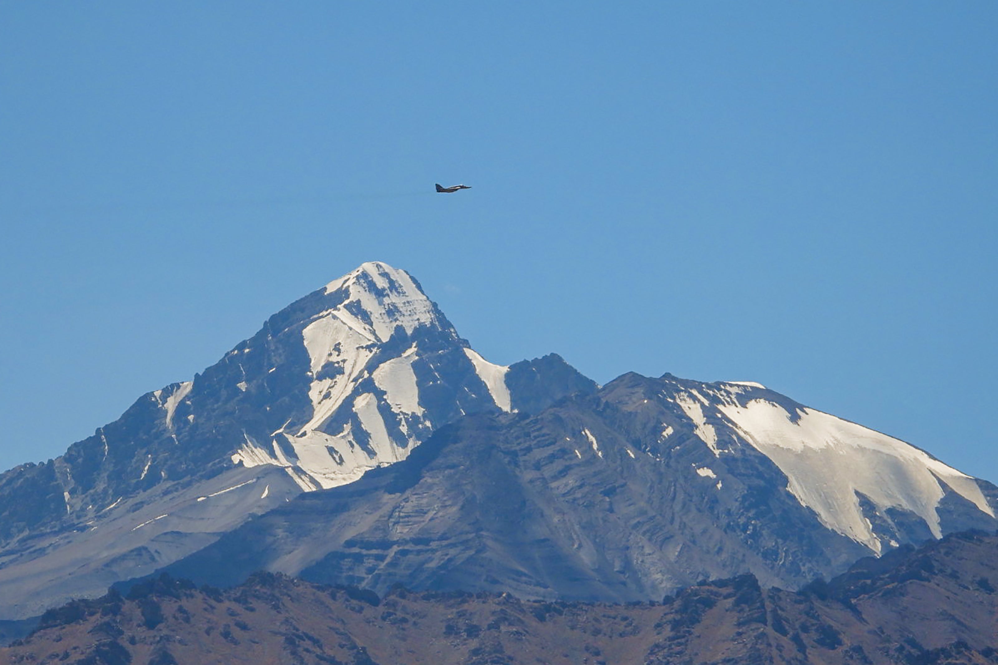 An Indian fighter jet flies over a mountain range in Leh, the joint capital of the union territory of Ladakh bordering China in September 2020