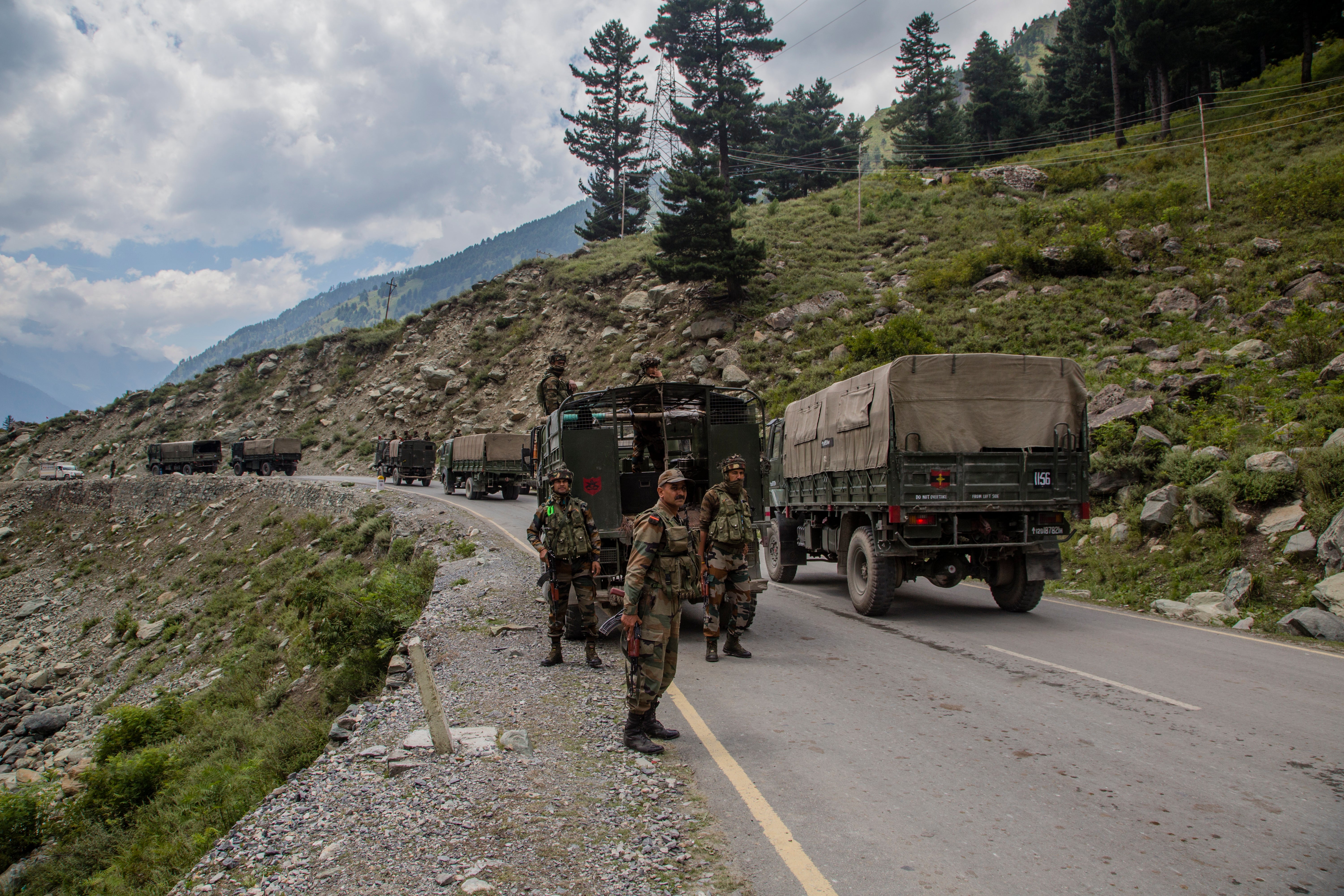 Indian army convoy carrying reinforcements and supplies, drive towards Leh, on a highway bordering China