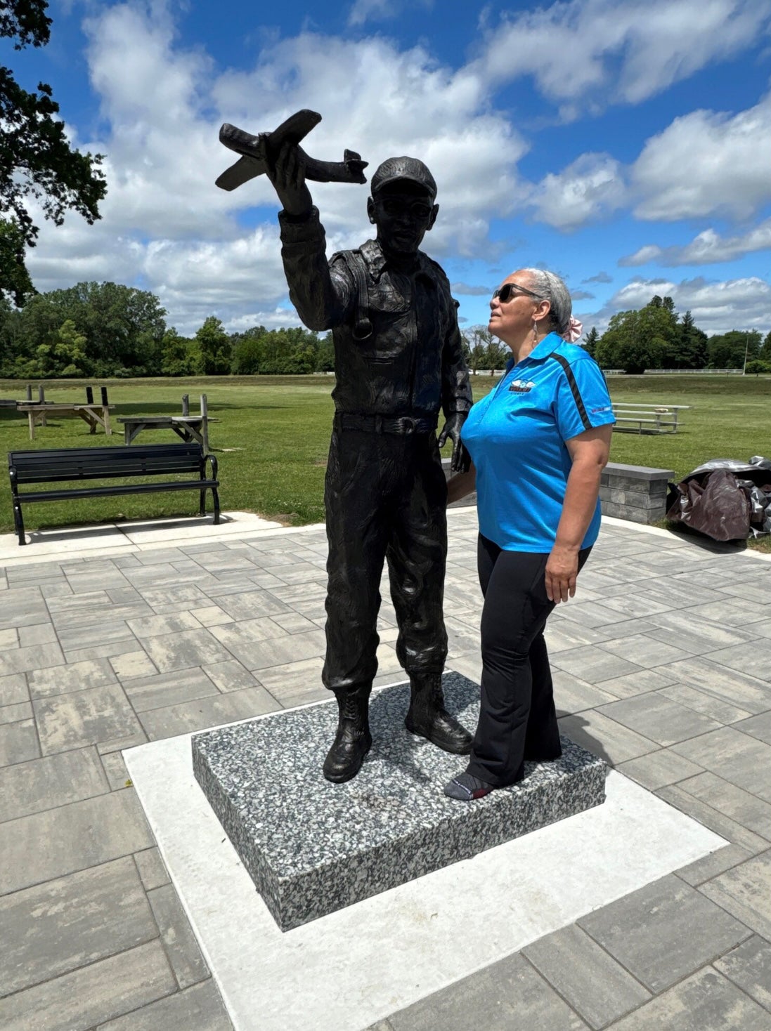 The granddaughter of Lt. Col Jefferson, Earnestine Lavergne, pictured standing with the statue of her grandfather in June